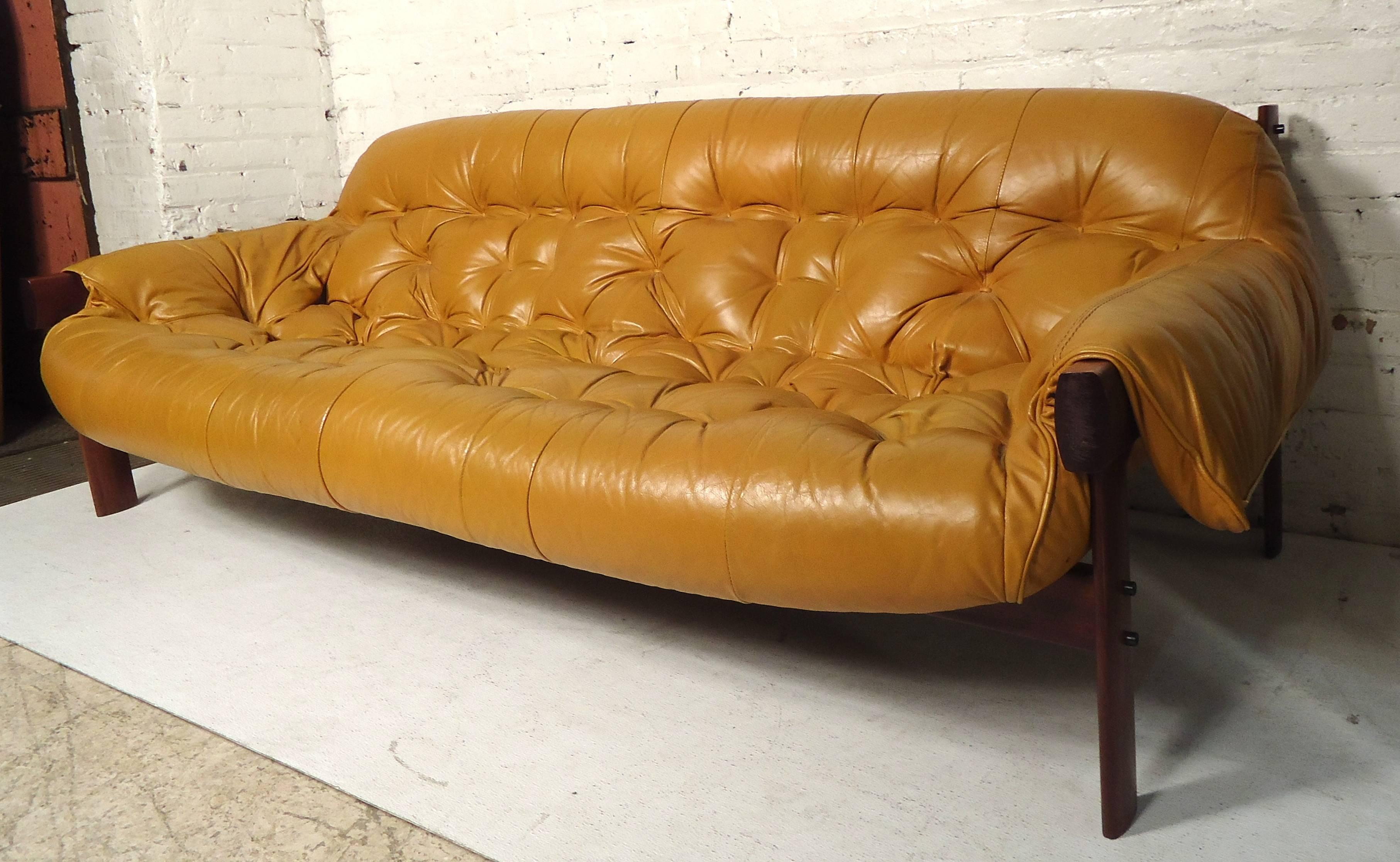 Stunning leather tufted sofa on a rosewood frame.

(Please confirm item location NY or NJ with dealer).
 