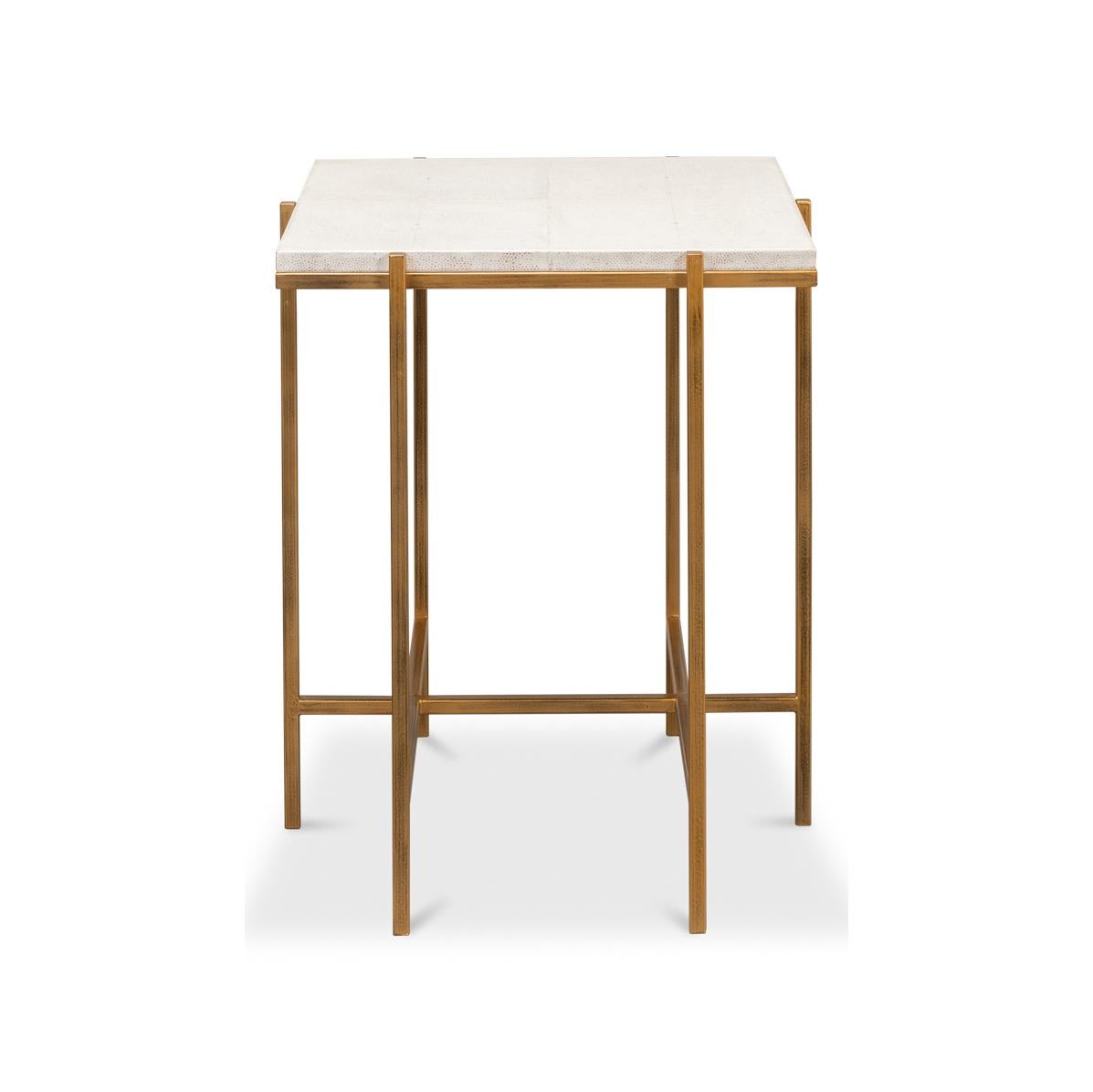 Designed to infuse an air of elegance into any space, this table features an embossed leather top in our Osprey white finish. The square top sits on a geometric, gold-tone iron cube frame that not only adds a contemporary flair but ensures stability