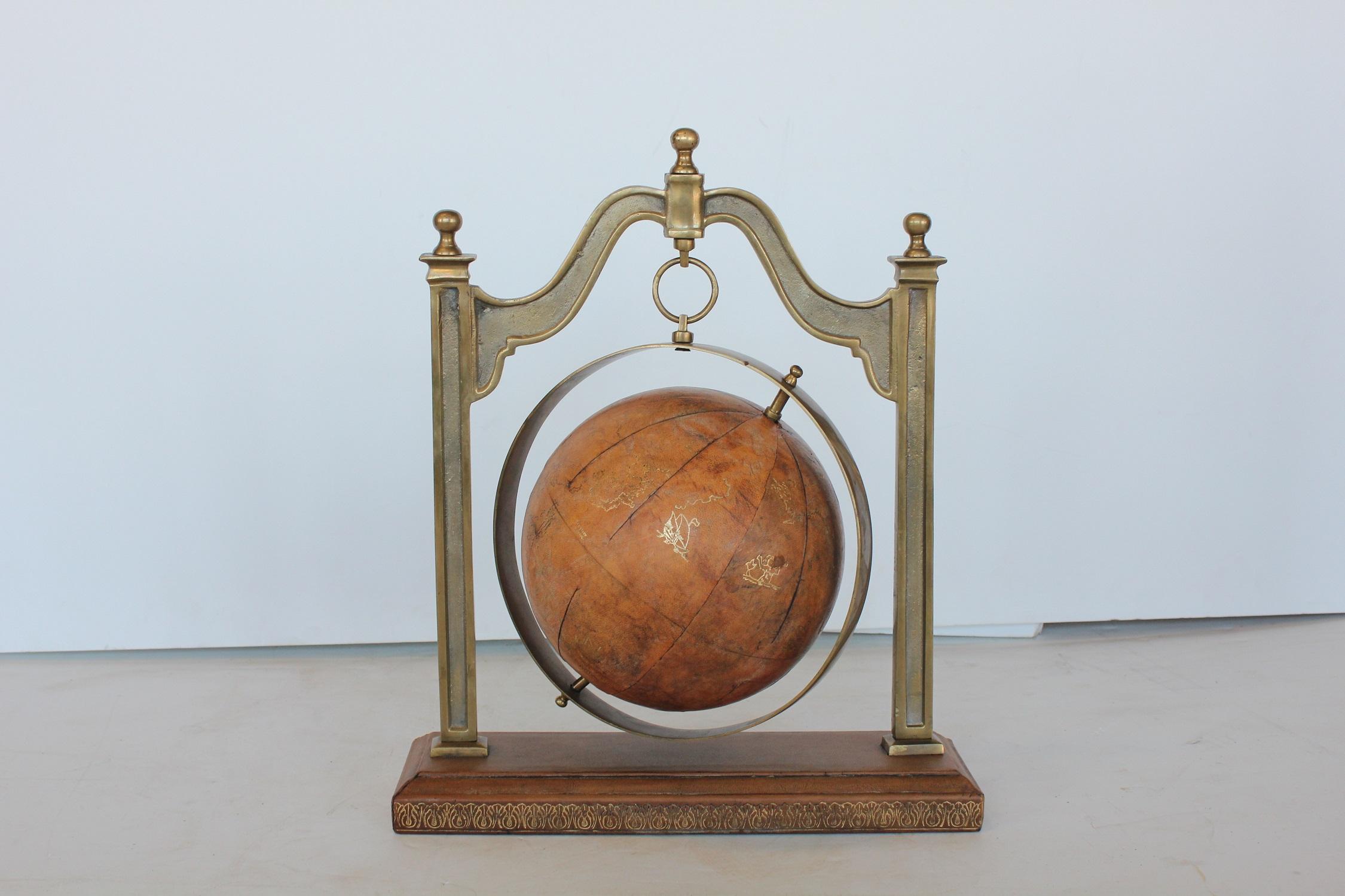 Midcentury leather world globe with brass stand by Sarreid.