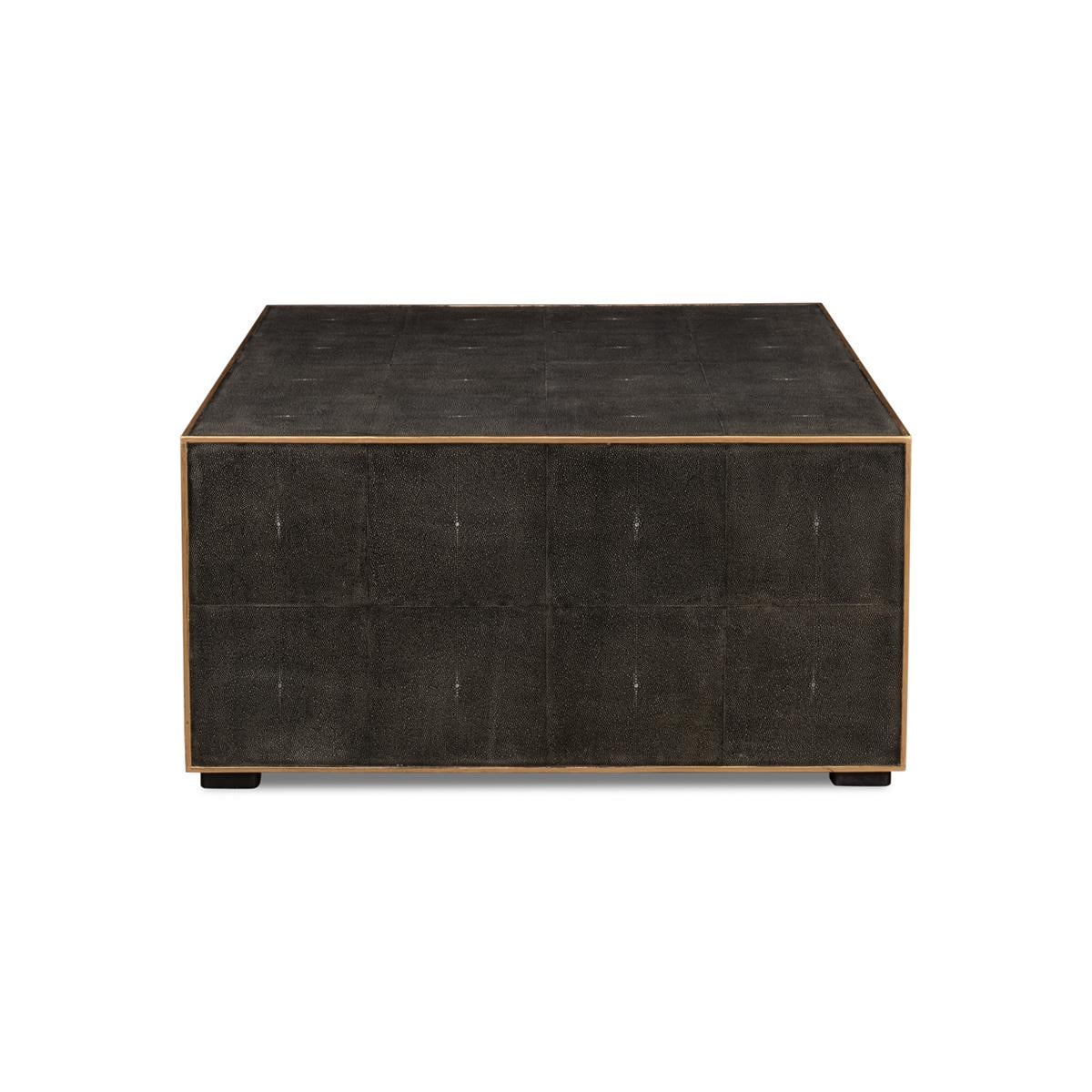 An elegant cube form embossed leather wrapped table in a dark antique gray finish with gold trim.

Dimensions: 36