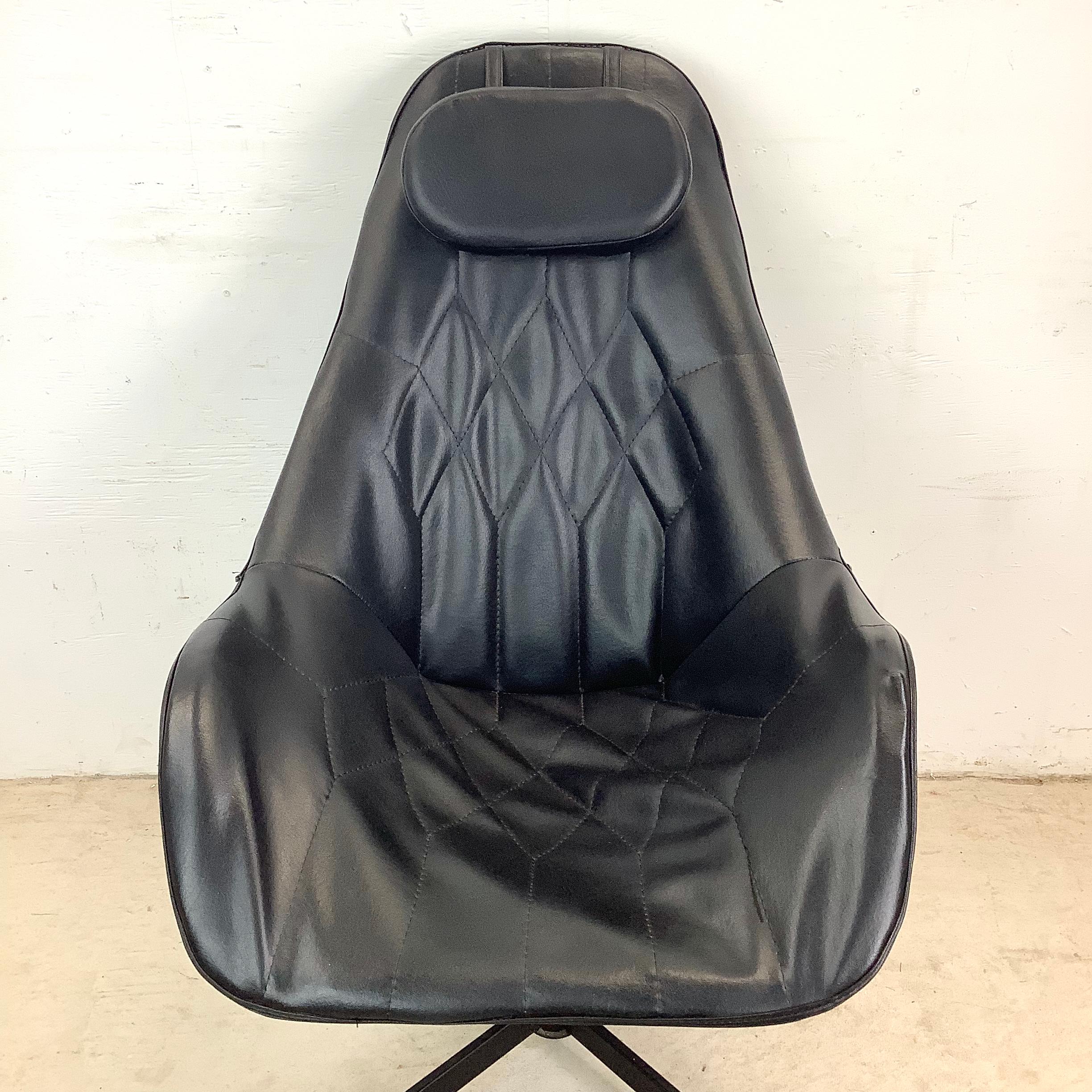 Evoking the effortlessly cool vibe of 1970s interiors, this high-back swivel lounge chair wraps you in comfort and style. With its tall, wing-like backrest and plump headrest cushion, the design is reminiscent of the iconic curves seen in George