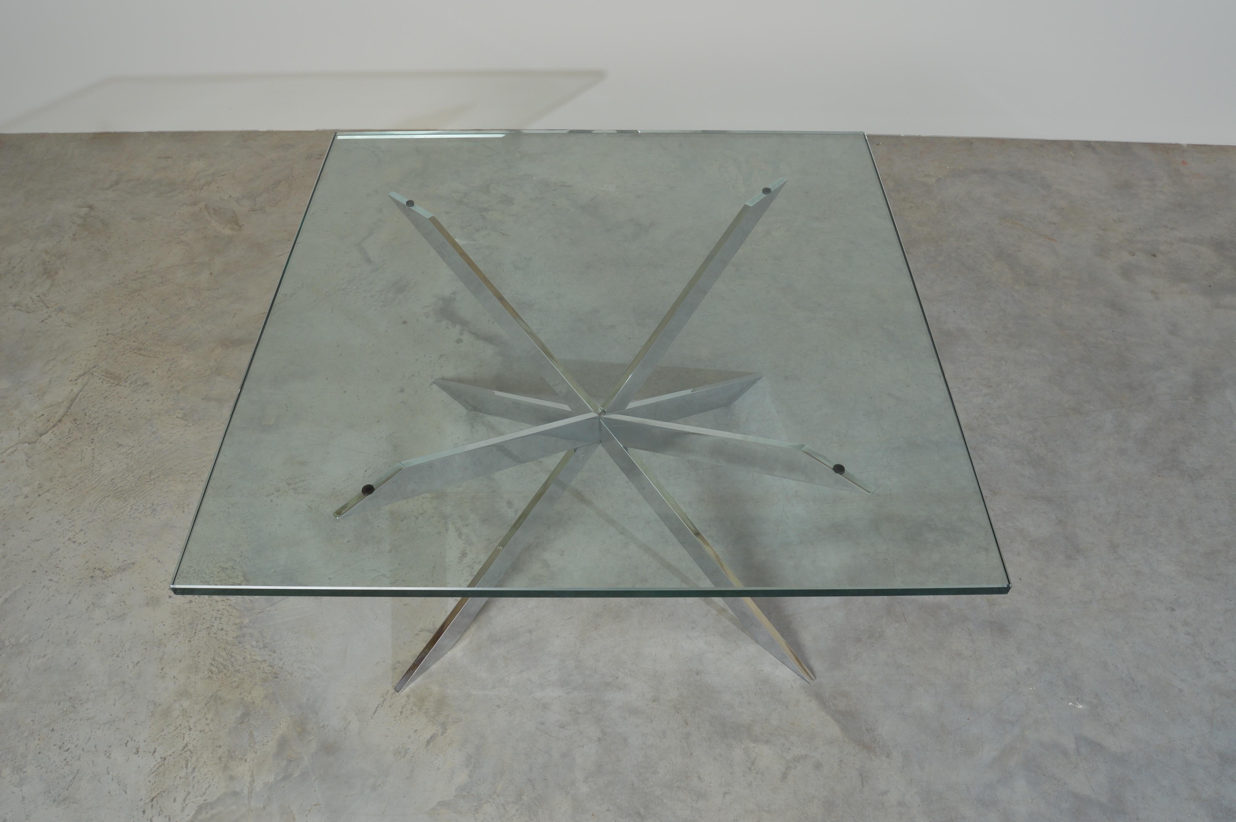 1970s square glass top cocktail table having solid chrome starburst base designed by Leon Rosen for Pace Collection.
Glass is 1” thick.
Beautiful condition. Well maintained by the original owner. Very clean and ready for use!