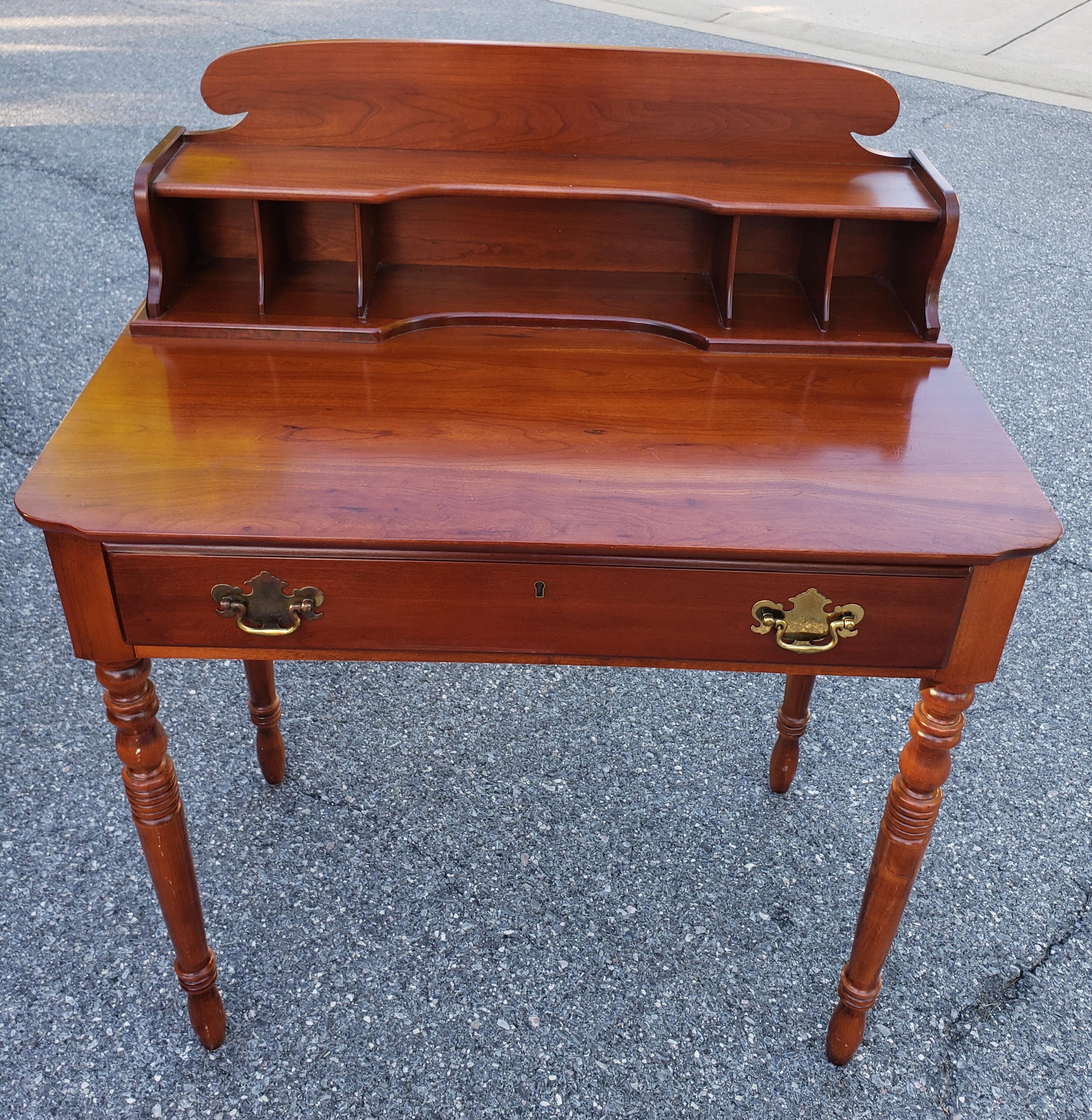 A Mid-Century Lexington Furniture Victorian Style Solid Cherry Writing Desk in great vintage condition. Measures 32