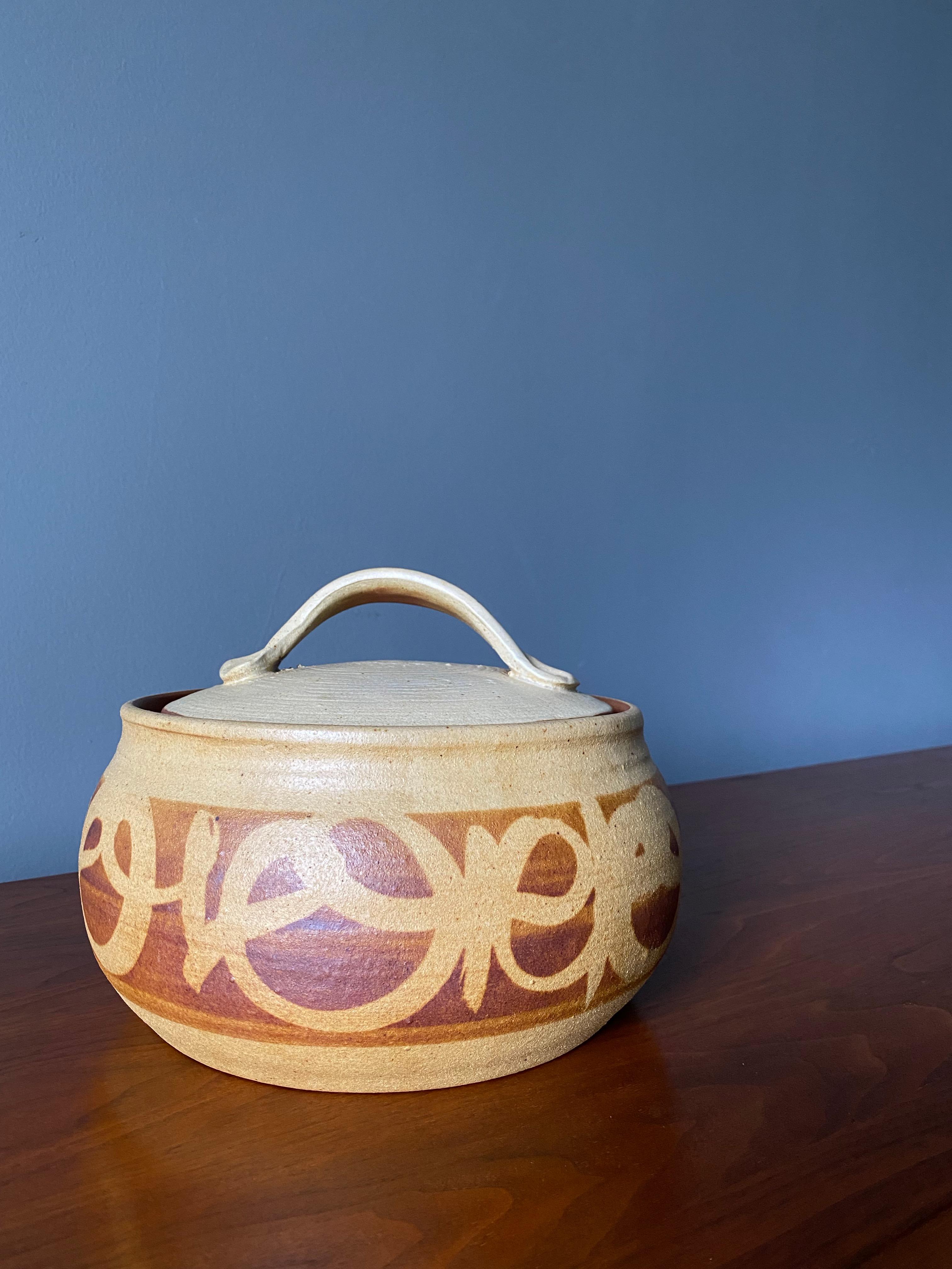 Vintage lidded ceramic bowl. Circa 1970's. Beautiful glazing in a neutral tone.
