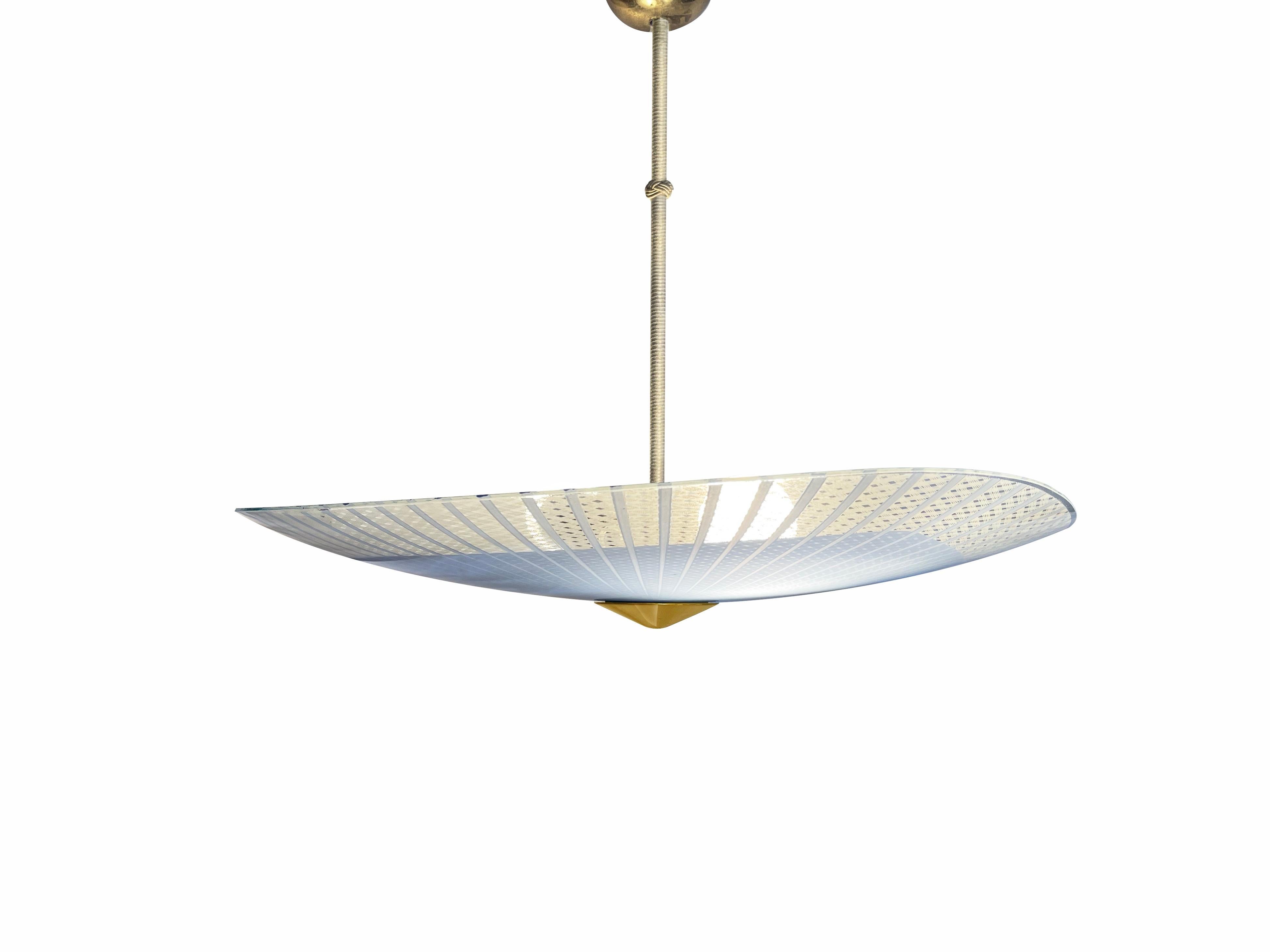 Magnificent ceiling lamp by 'Doria Leuchten', one of Germany's famous mid century manufacturer of high-end design lighting.
Comes in a rounded and elegantly curved triangle disk shape, from cut and printed glass. 
The print colours are a matte white