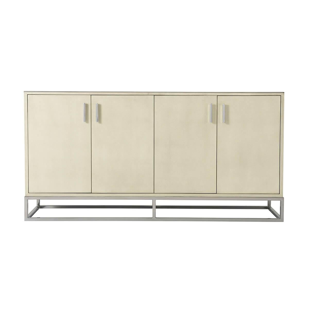 A leather wrapped case, in our light overcast finish, with four doors, enclosing interior shelves. Having nickel-finished hardware and an open cubed base frame.

Dimensions: 63