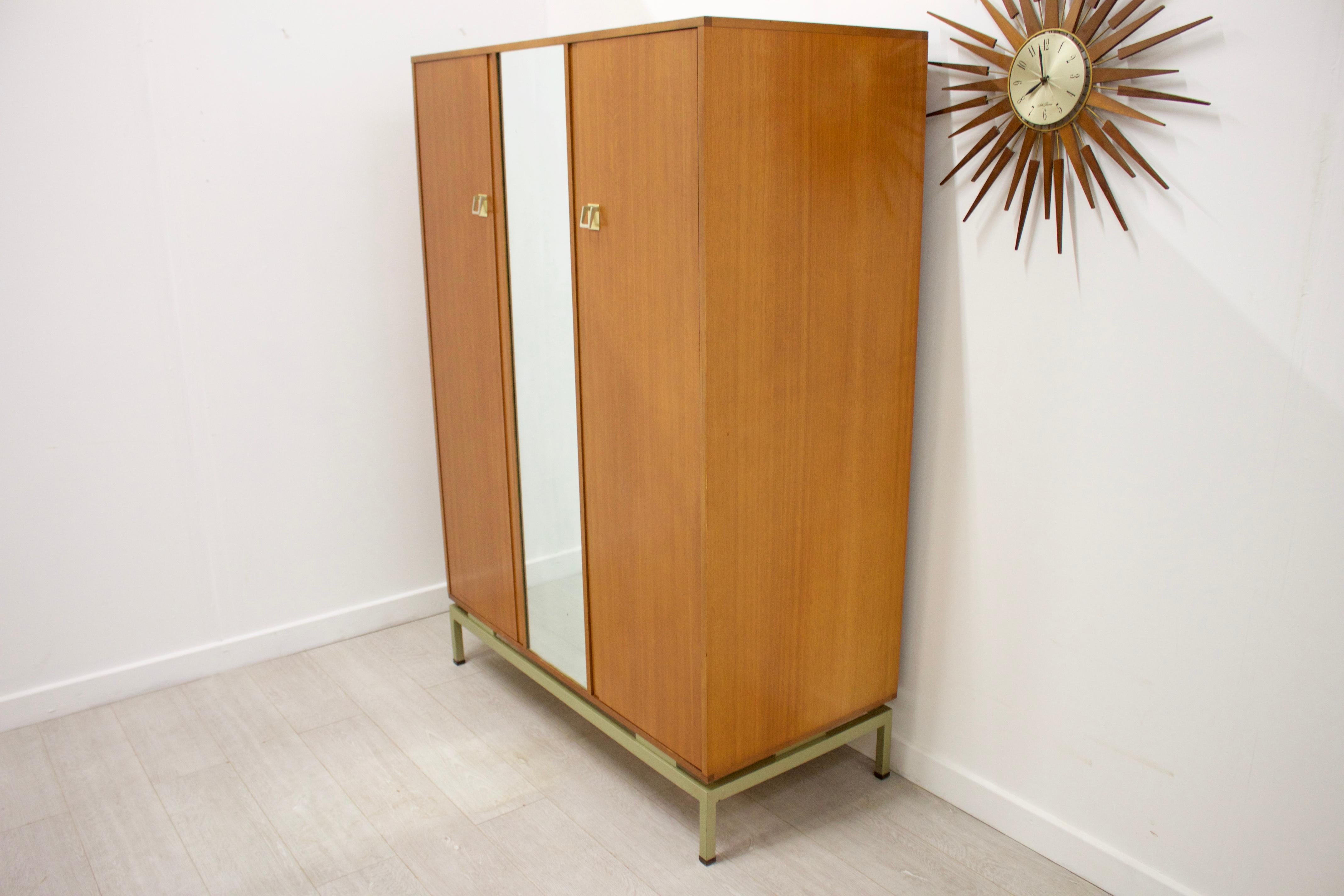 - Mid-Century Modern wardrobe
- Manufactured by G Plan in the 1960s
- Designed by Lesley Dandy
- Made from Limba wood which is similar to teak
- Featuring a hanging rail the full width of the wardrobe.