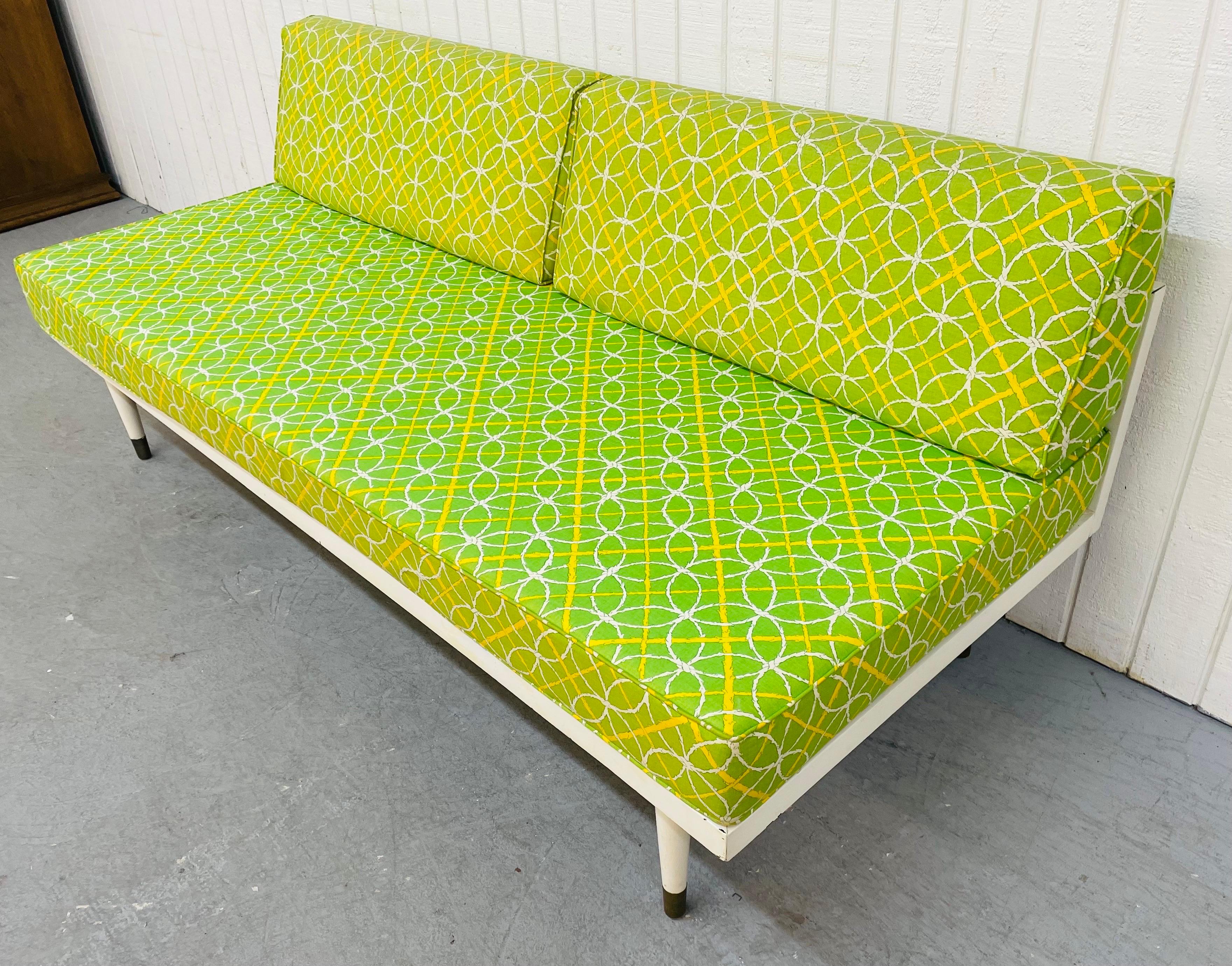 This listing is for a Mid-century lime green day bed. Featuring original removable upholstered cushions, wood frame that has vintage off-white paint, and screw-on legs with brass caps.