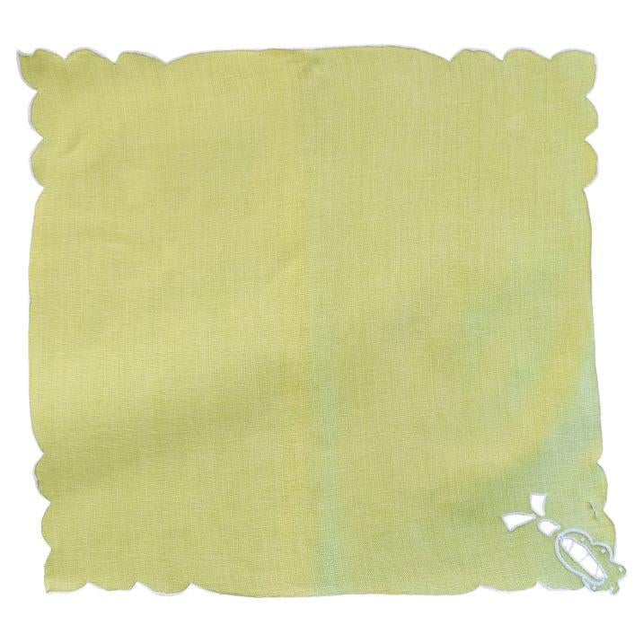A set of four lime green cloth dinner napkins. I beautiful mid-century or chinoiserie set that will elevate any place setting. Each napkin is created from lime green fabric and stitched with a pierced white thread detail around the scalloped edges.
