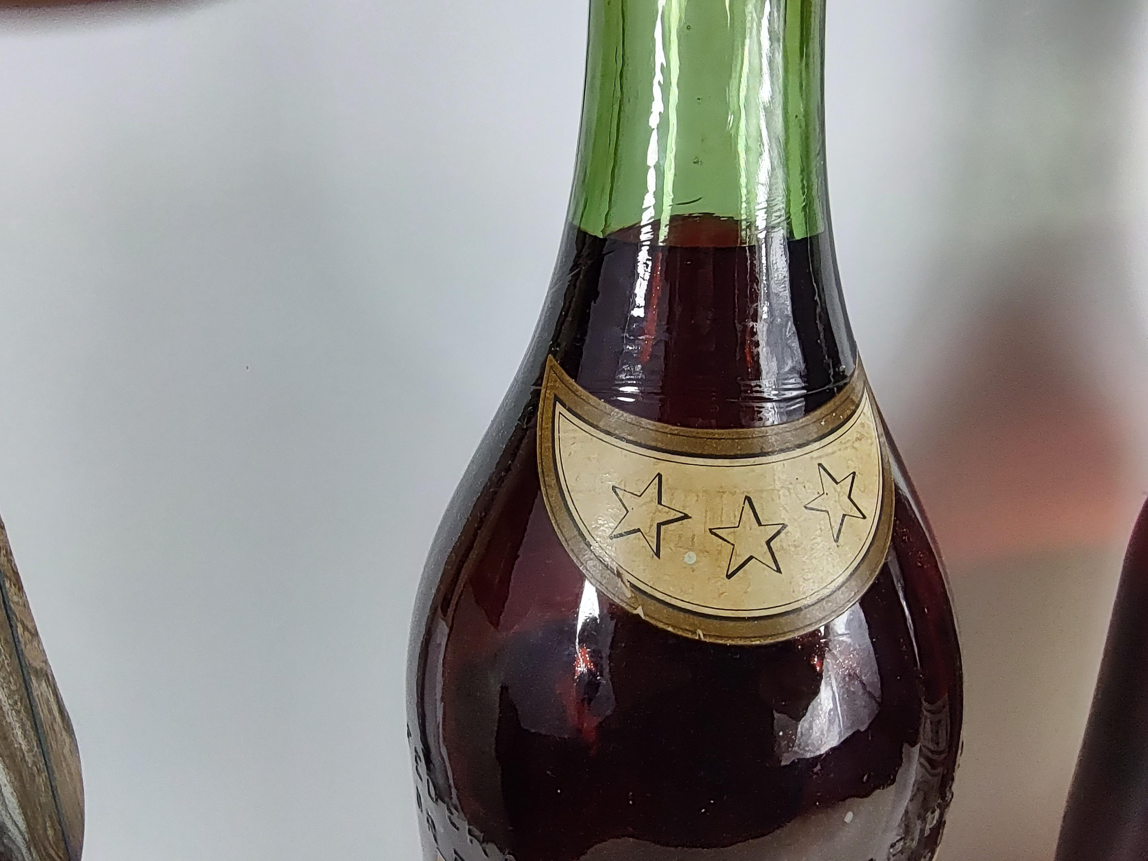 Fabulous display bottles from the fifties. Solid glass and painted on the inside to look like the bottle is full. COURVOISIER the brandy of Napoleon is the only bottle available. Priced and sold separately. Can be parcel posted. Hennessy bottles are