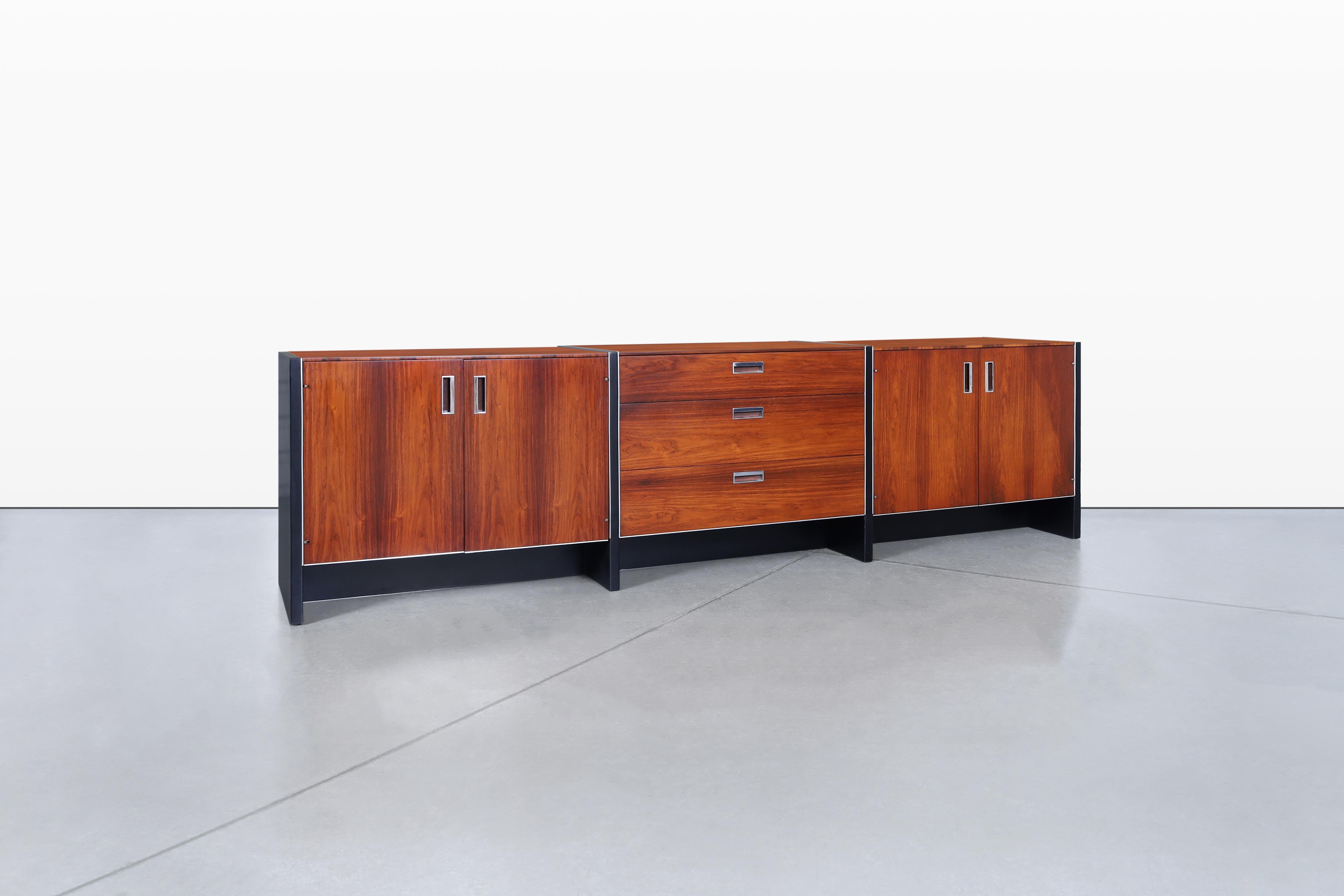 Experience the elegance of mid-century design with this stunning rosewood credenza, a masterpiece crafted by Robert Baron for Glenn of California in the 1960s. This piece is particularly special as it is one of the longest credenzas designed by