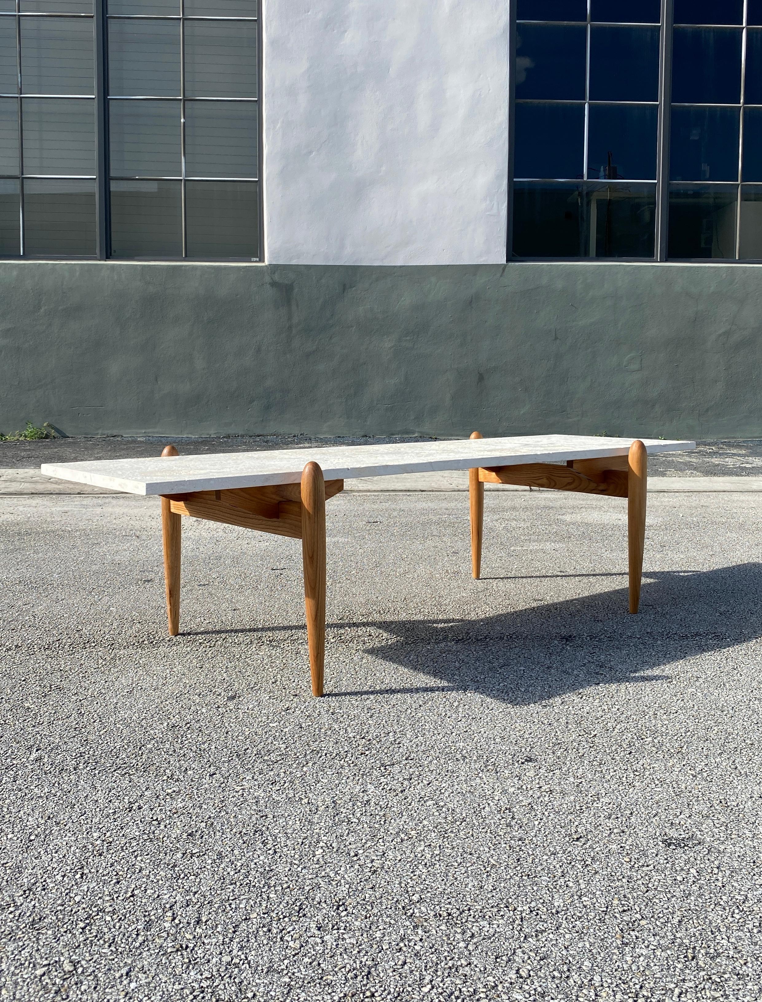 Vintage sleek coffee table made of walnut base and Travertine stone top in excellent vintage condition.

Measures: 58.5”L x 18”W x 15.5”H.

Stone 58.5”L x 17.5”W.