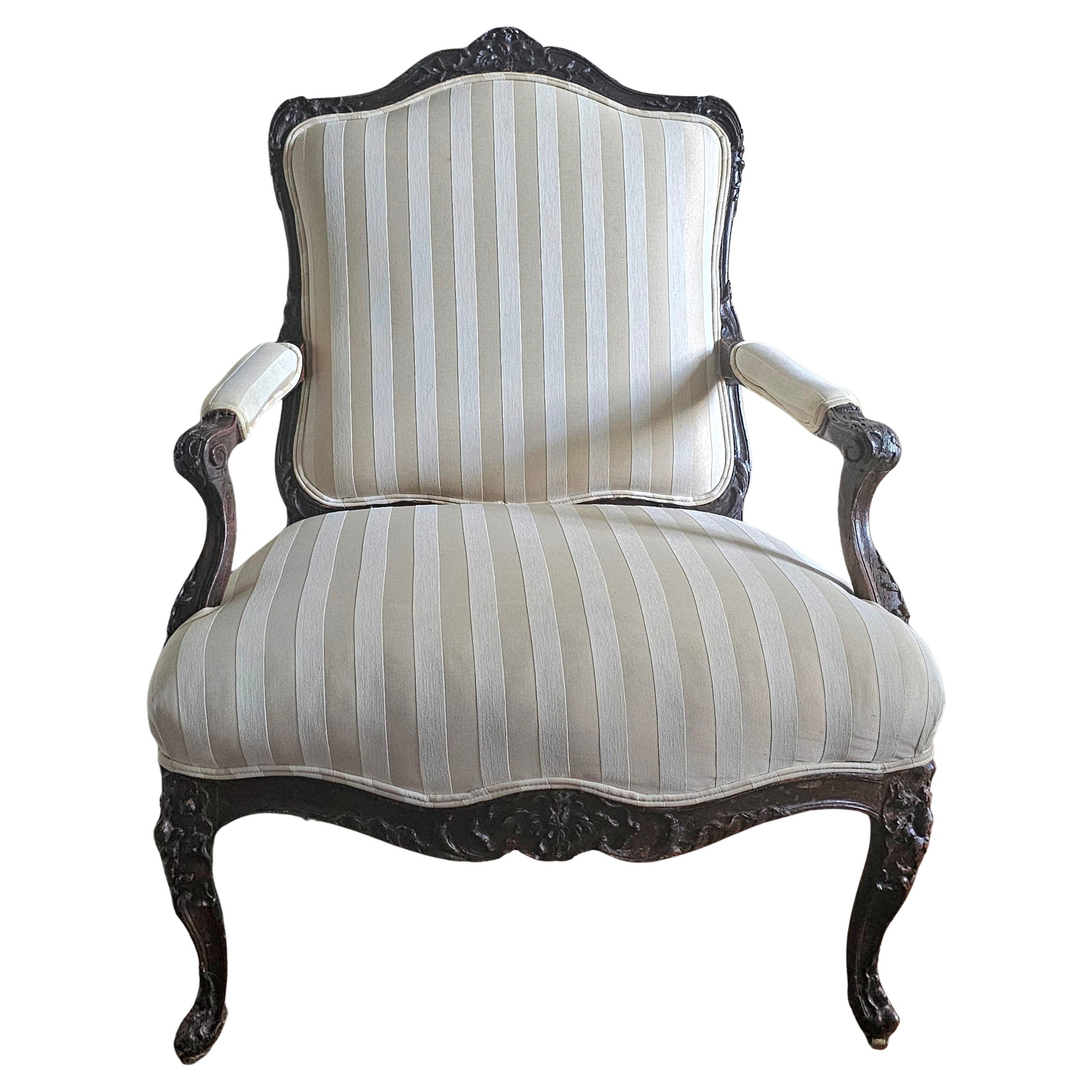 Late 19th Century Louis XV Style Carved Oak and Upholstered Fauteuil
