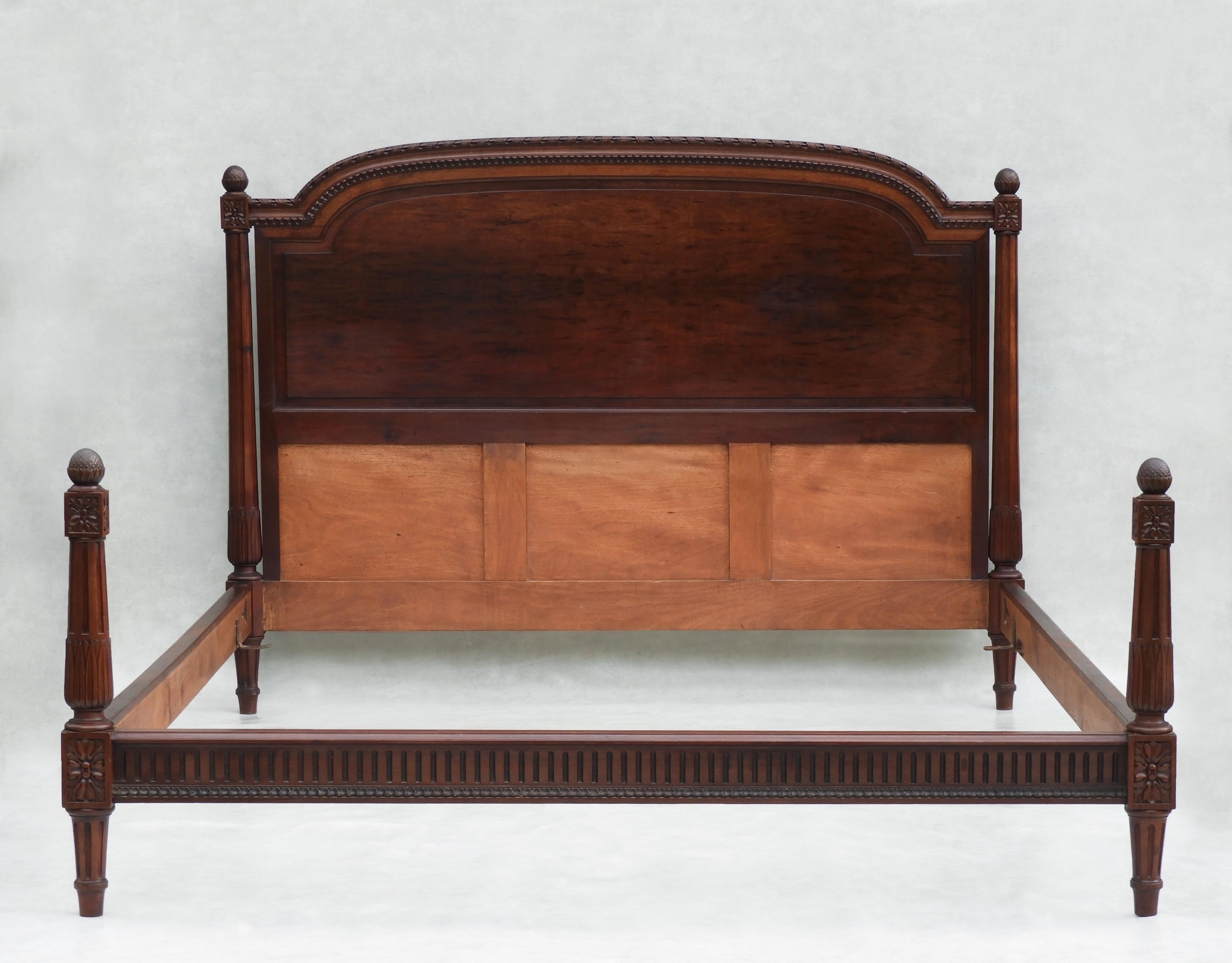 Gorgeous Louis XVI Revival four-post double bed from mid-century France.
A specially commissioned footless bed in dark stained cherry wood. All original, in great vintage condition, with nice age-related patina.  This bed is a European kingsize,