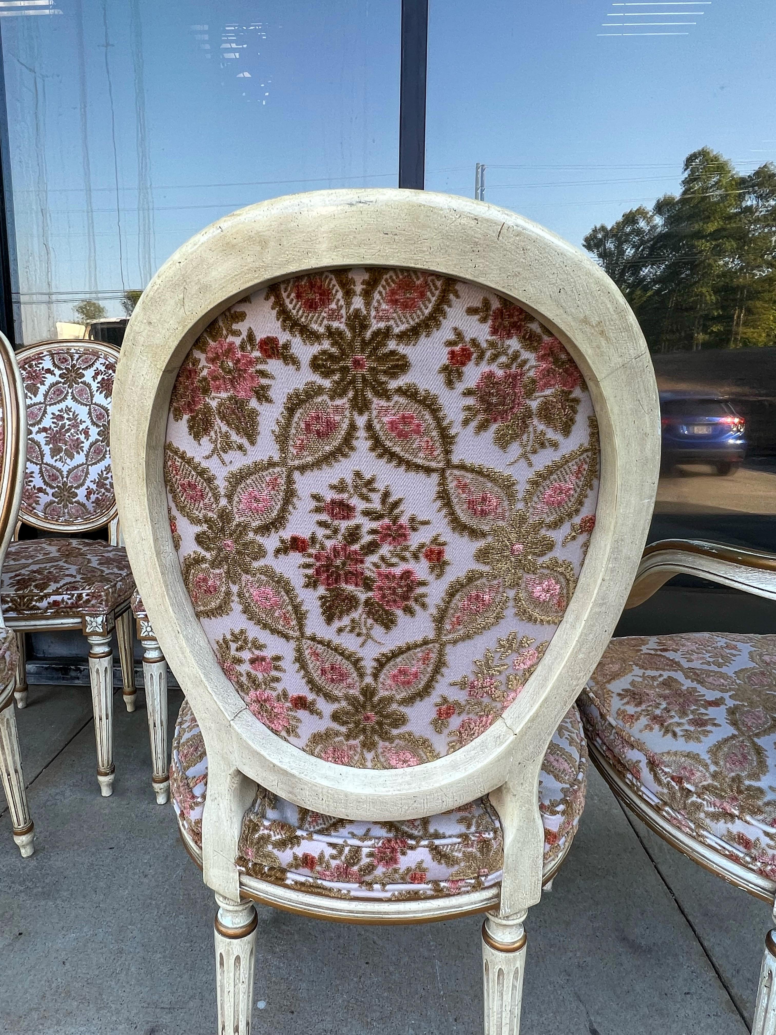 These are wonderful! This is a set of eight dining chairs manufactured in the 1960s by Karges. They have Louis XVI styling, and the cut velvet is original it is in surprisingly good shape! The frames have a nice patina and are ivory and gilt. The