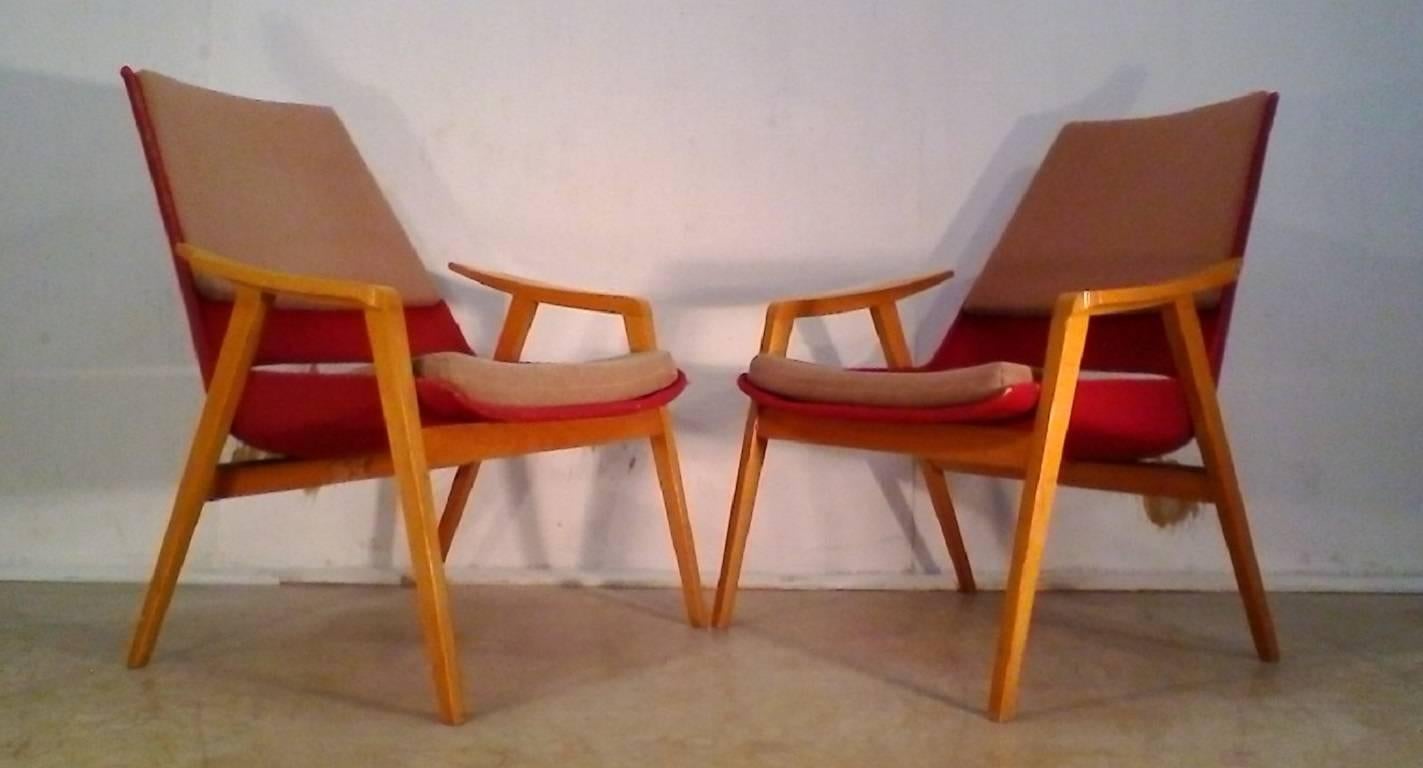 Armchairs by Miroslav Navratil, manufactured in Czech by TON Bystrice pod Hostýnem, 1959. Original wooden base, fiberglass shell seating with upholstery.