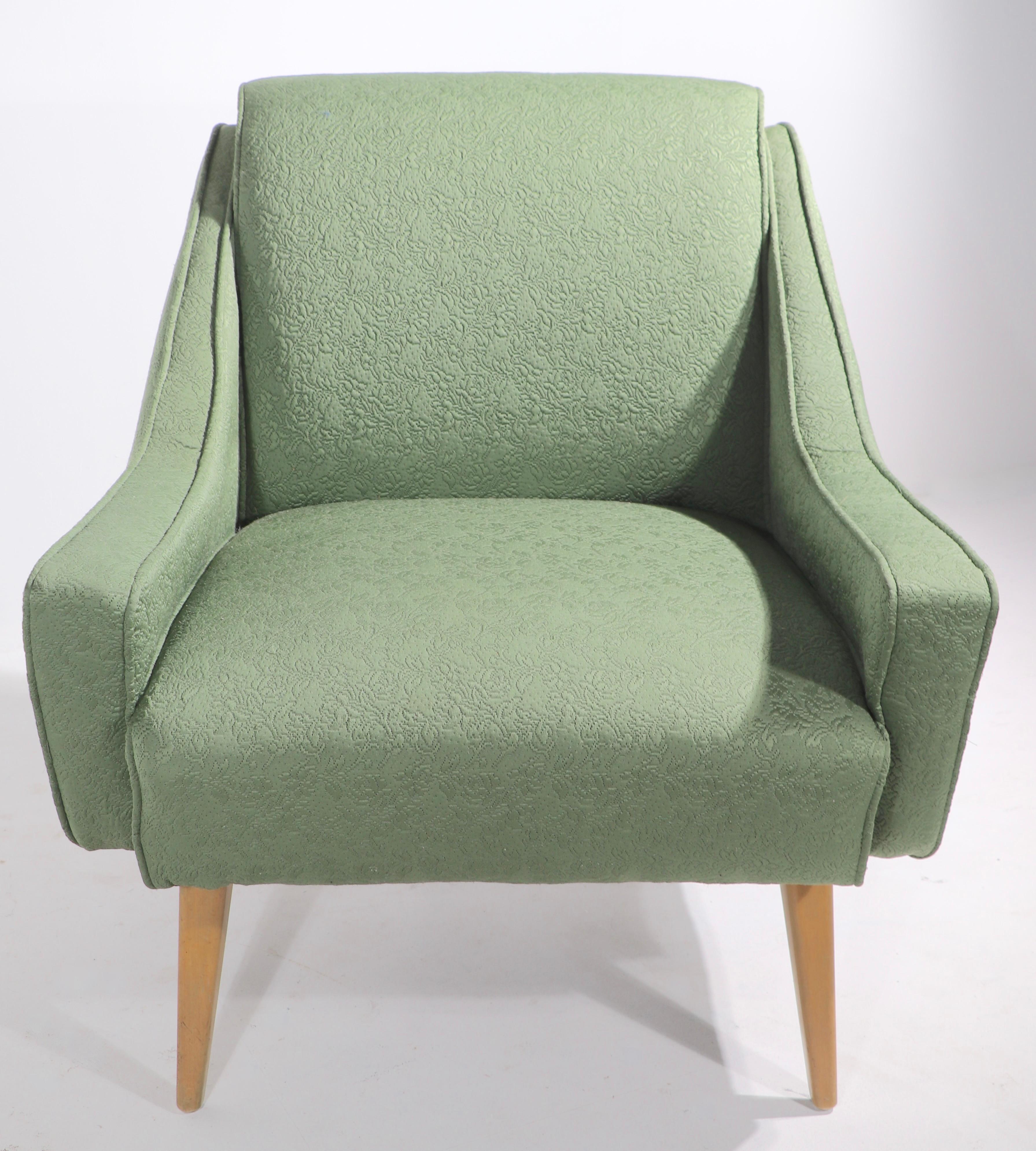 Chic and stylish lounge chair attributed to Heywood Wakefield. This example is in extra clean, ready to use condition, it has been reupholstered. 
 Measures: Total H 32 x arm H 21 x seat H 
 W 29 x D 23 inches.