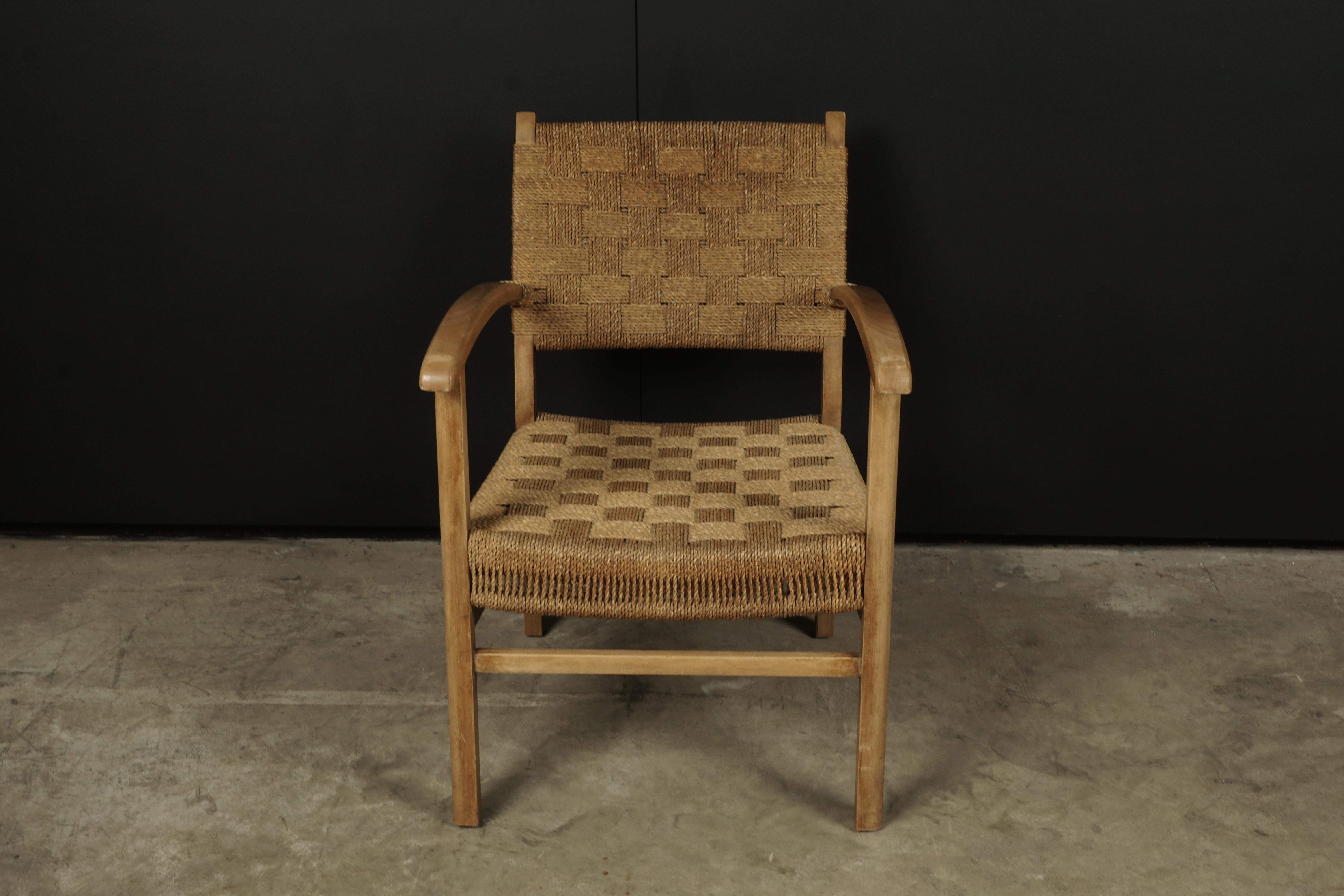 Midcentury lounge chair from Denmark, circa 1960. Woven paperboard seat and back on a solid birch frame. Nice wear and patina.
