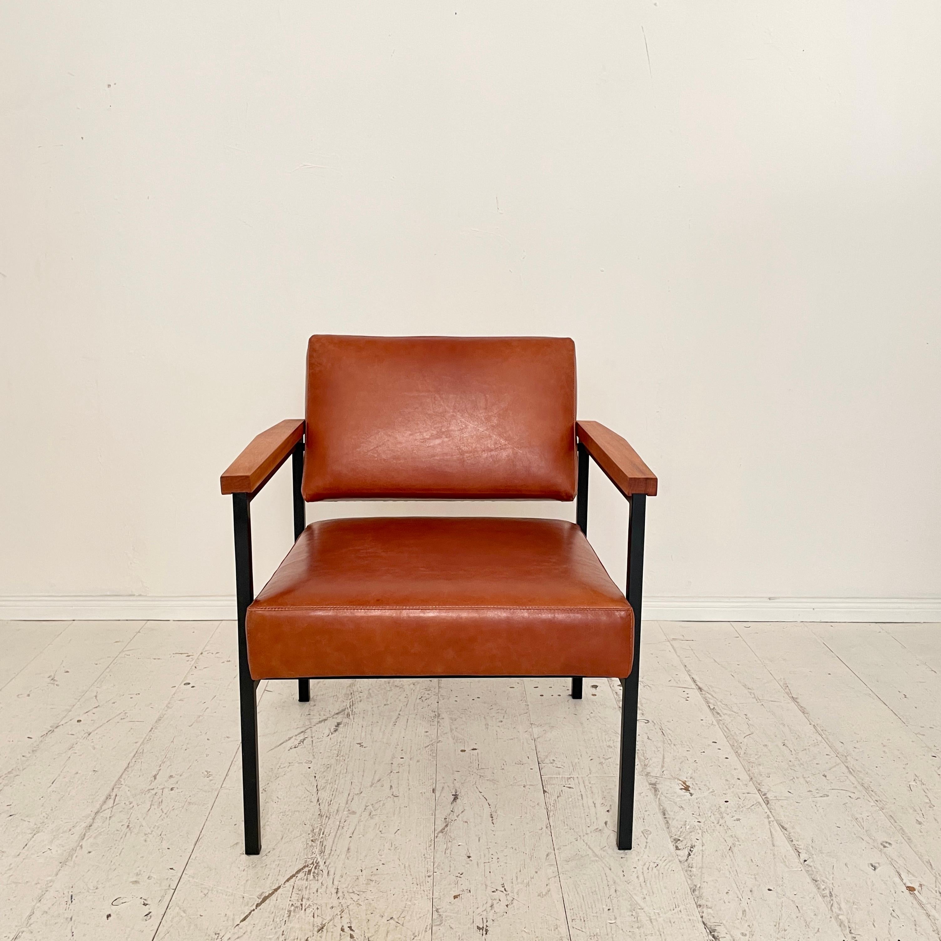 This beautiful midcentury Lounge Chair was made in the 1960s in South Germany. The Chair has got a black lacquered metal Base and just got re-upholstered in Brown Leather.
 A unique piece which is a great eye-catcher for your antique, modern, Space