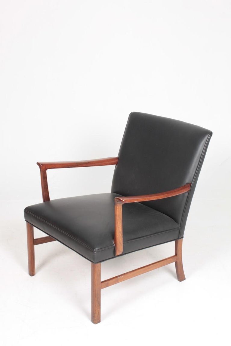 Scandinavian Modern Midcentury Lounge Chair in Rosewood and Leather by Wanscher, Danish Design 1950s For Sale