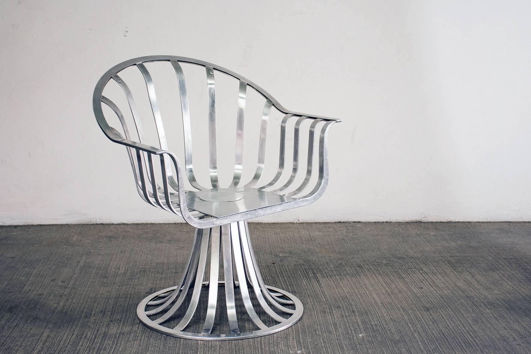 Gorgeous set of Russell Woodard polished aluminium chairs produced in the early 1960s.