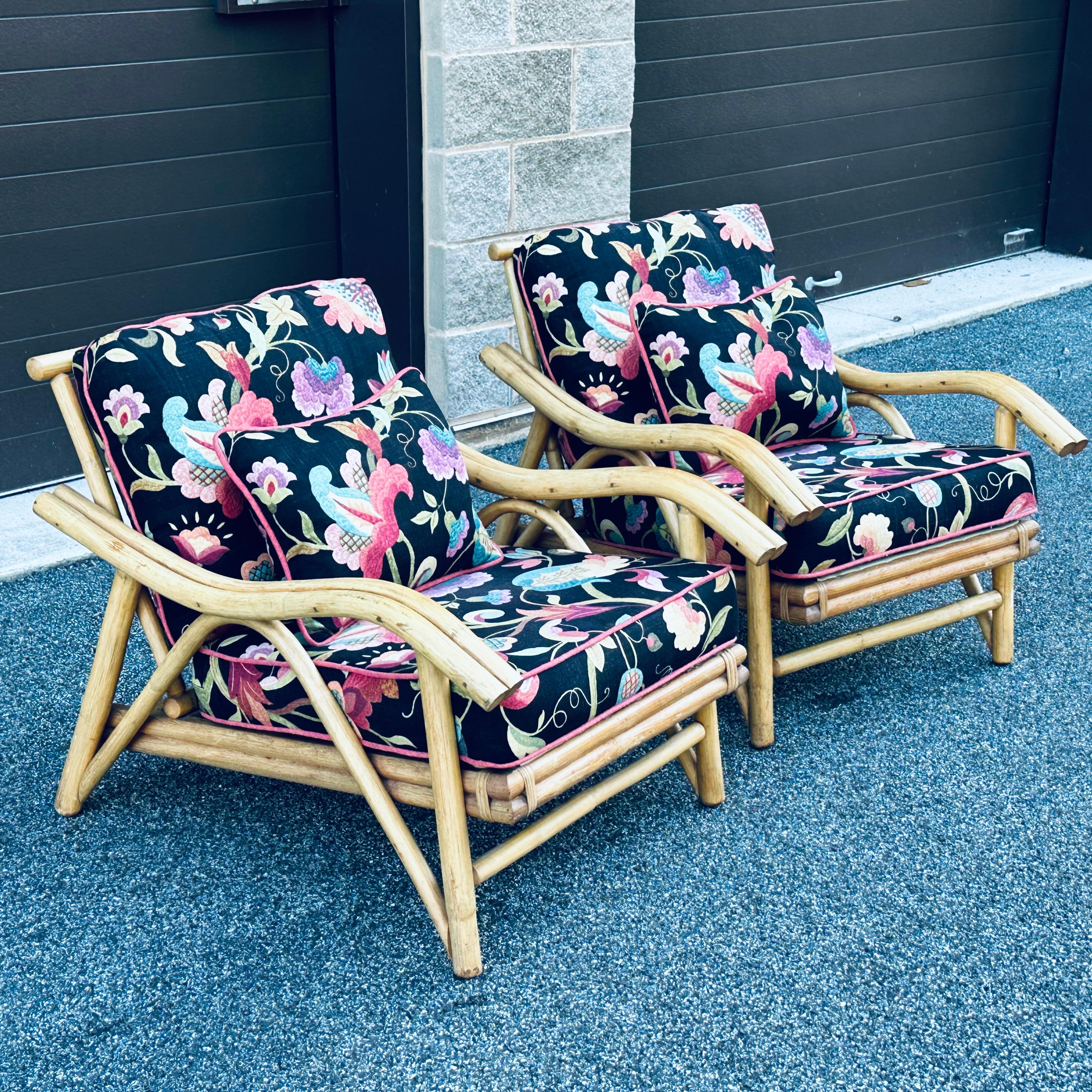 Pair of rattan lounge chairs by Superior Reed & Rattan Furniture Co. Inc of NYC. Frames in the original finish with newer high end upholstery.