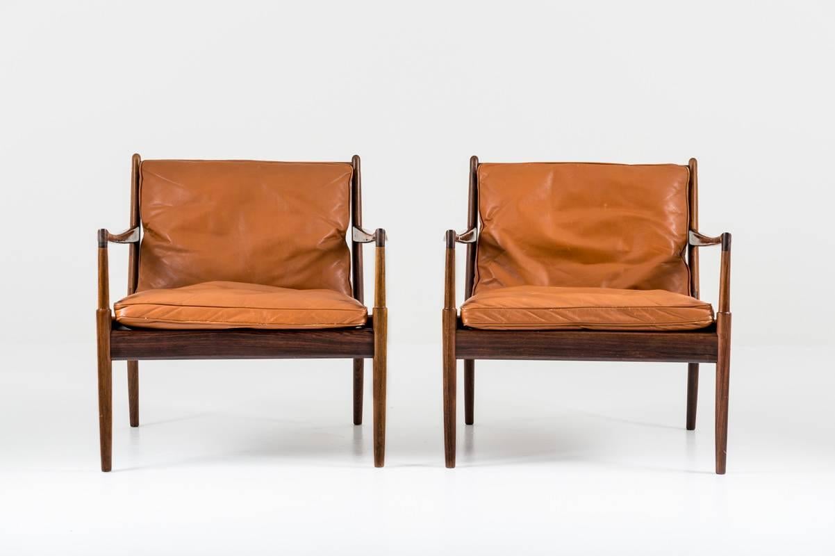 A pair of lounge chairs model 