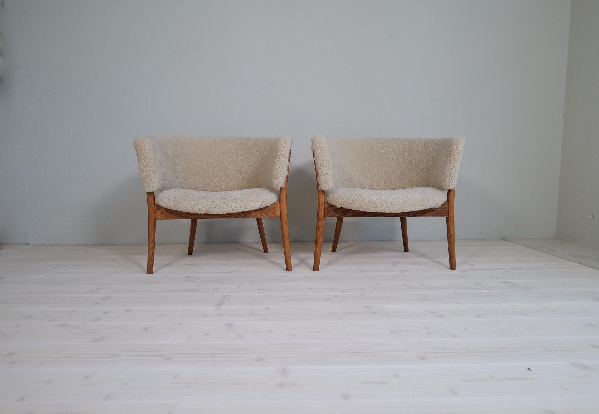 Mid-Century Modern Mid-Century Lounge Charis in Sheepskin/Shearling and Stained Wood, Sweden, 1962 For Sale