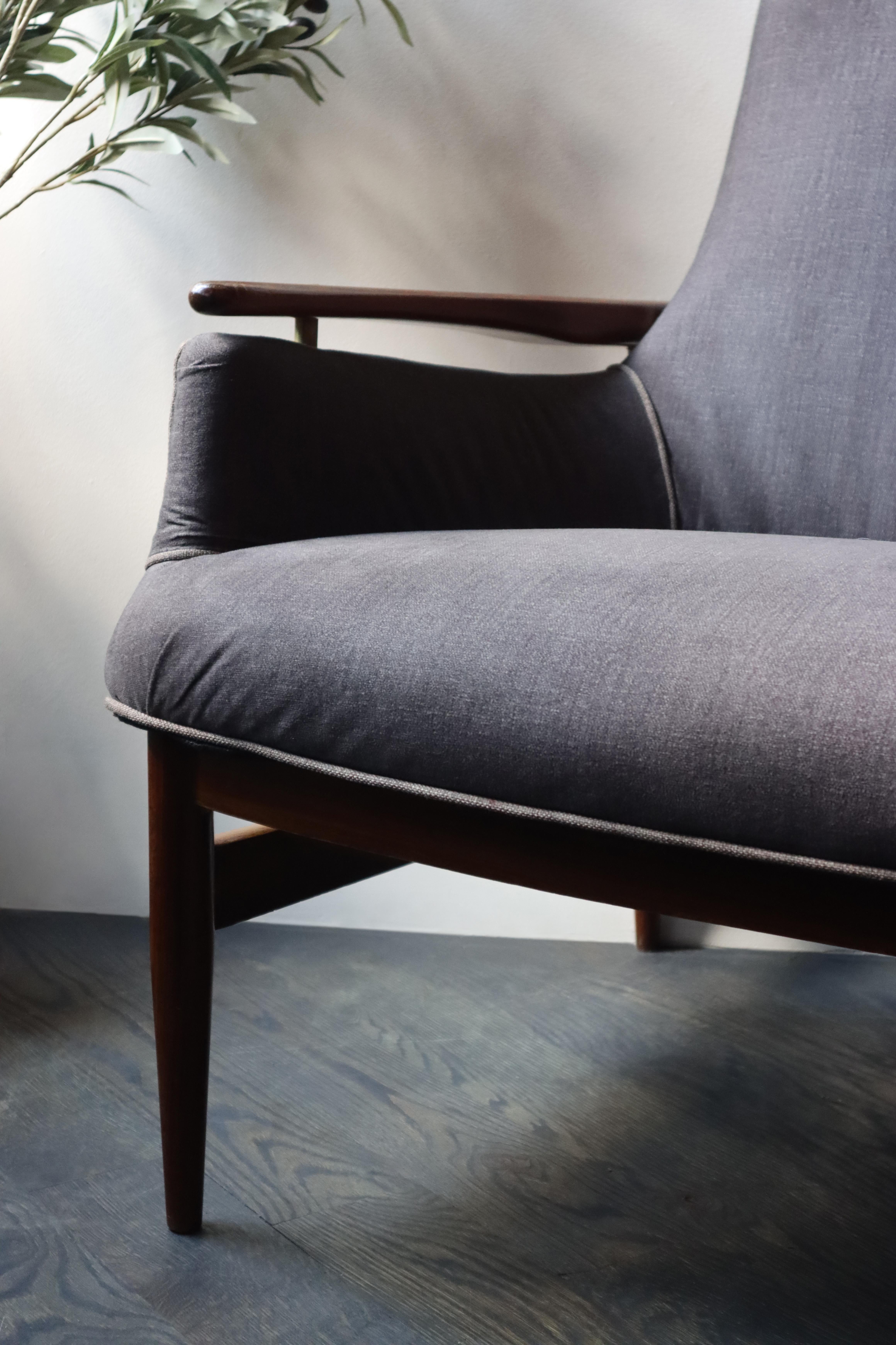 A Classic Mid-Century Modern, Danish wood love seat.