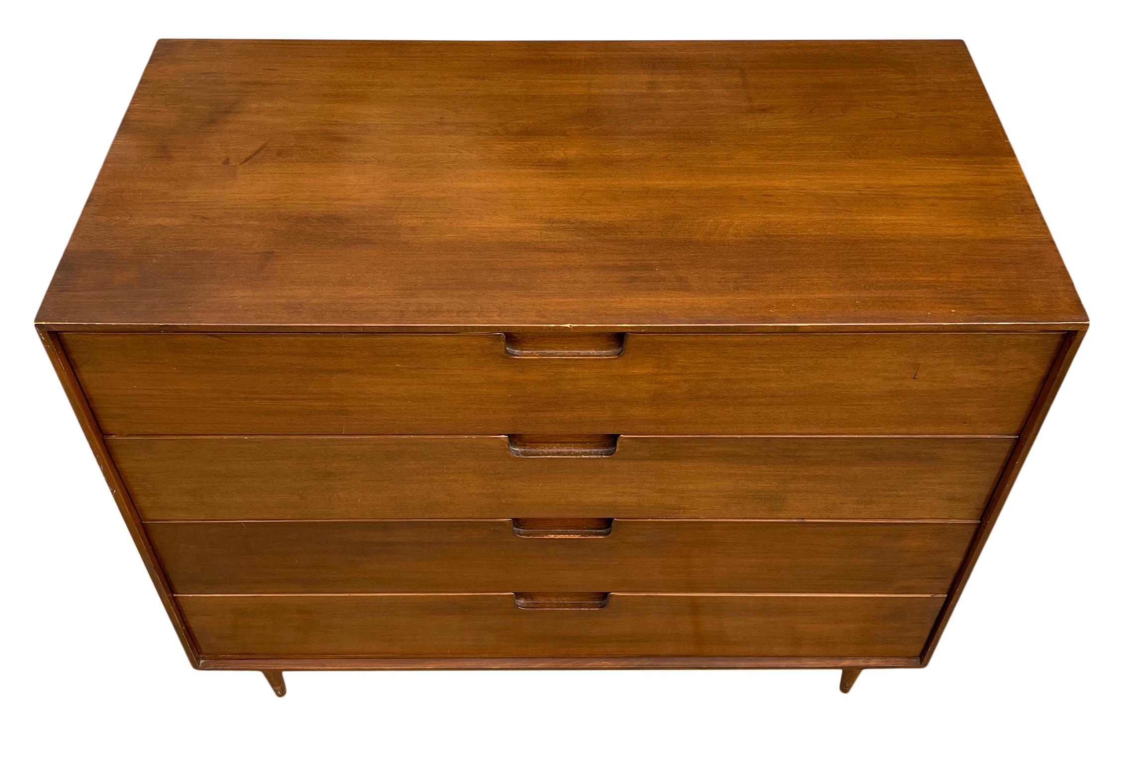 Mid century 4 drawer dresser low walnut finish on small tapered legs. No label solid wood very sturdy and drawers and dresser are clean inside and out. Drawers slide smooth has carved handles.

Located if Brooklyn NY.