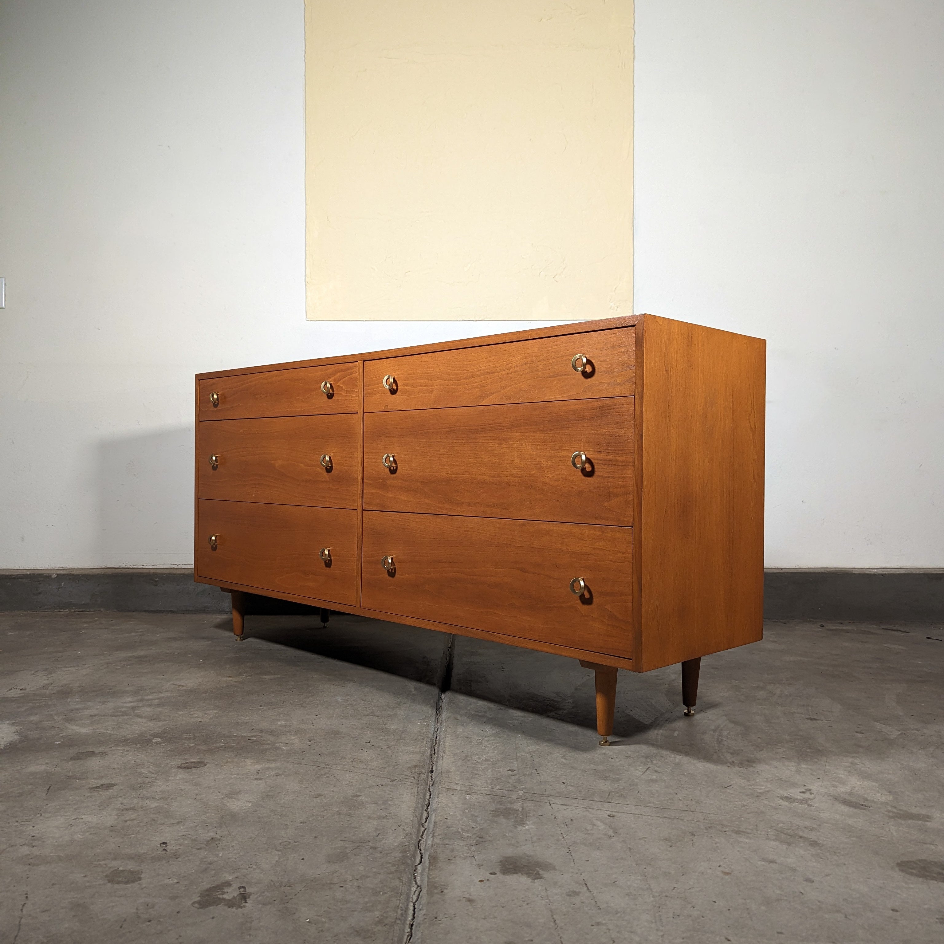 Discover the epitome of mid-century modern elegance with this stunning vintage mahogany dresser, a timeless piece designed by the renowned Greta M. Grossman for Glenn of California, circa 1950s. This exquisite dresser is a testament to Grossman's