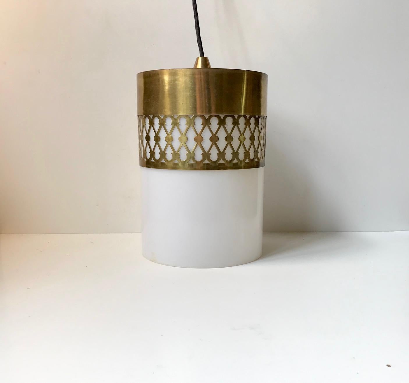 Danish ceiling light designed by Bent Karlby for Lyfa, Denmark and manufactured in the mid-1960s. The light consists of white fluorescent Lucite shade set in a top of perforated brass that has patinated charmingly over the years. This light is