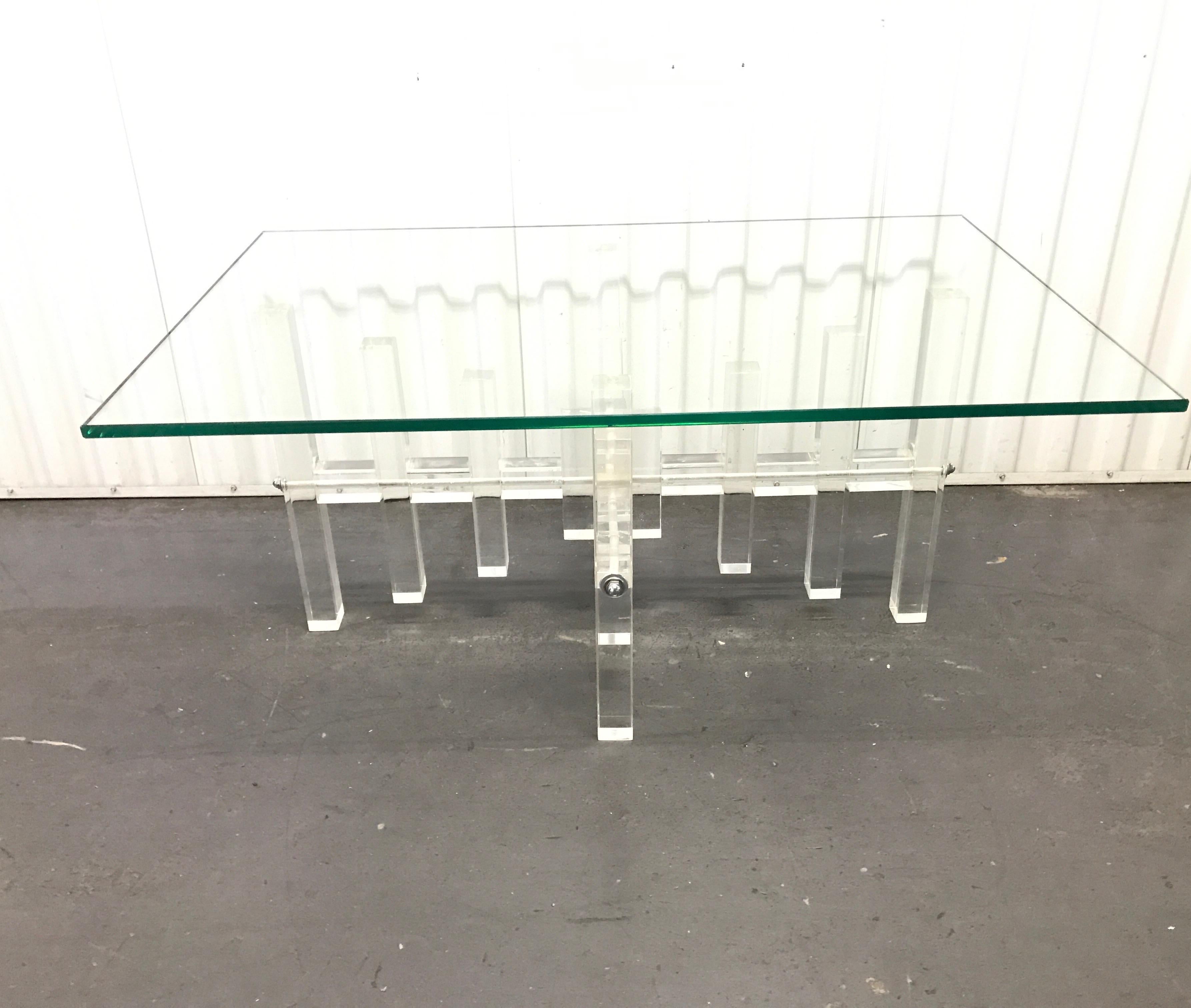 Midcentury Lucite coffee table with glass top.