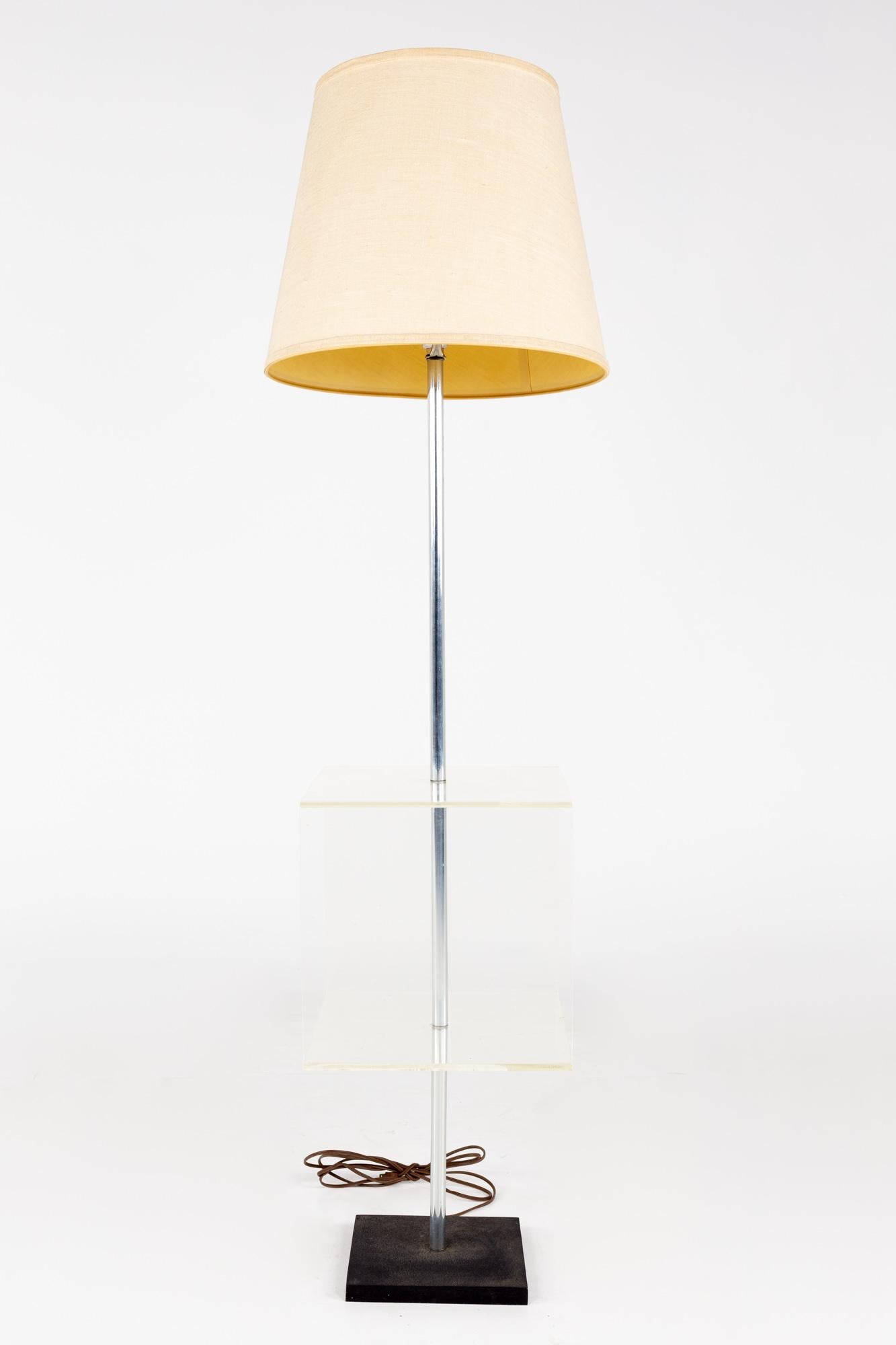 Mid century Lucite table floor lamp

This lamp measures: 16 wide x 16 deep x 56 inches high

This lamp is in good vintage condition

We take our photos in a controlled lighting studio to show as much detail as possible. We do not photoshop out