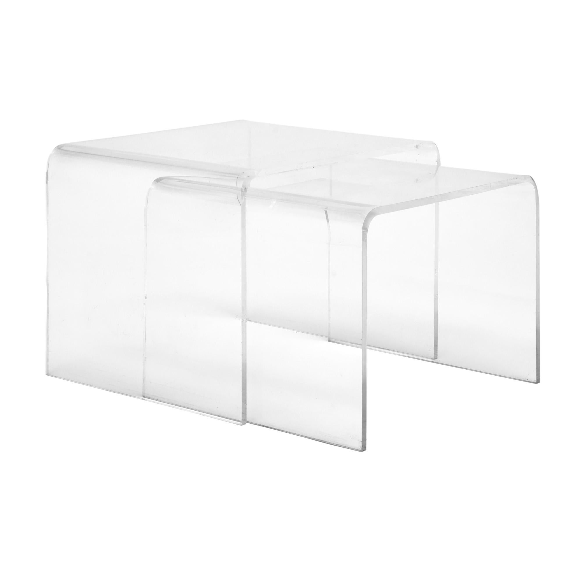 Pair of nesting tables from France with a waterfall design made of Lucite. This pair’s classic modernist design makes them perfect for a small space and functional use. They are in very nice vintage condition with only minor surface wear consistent