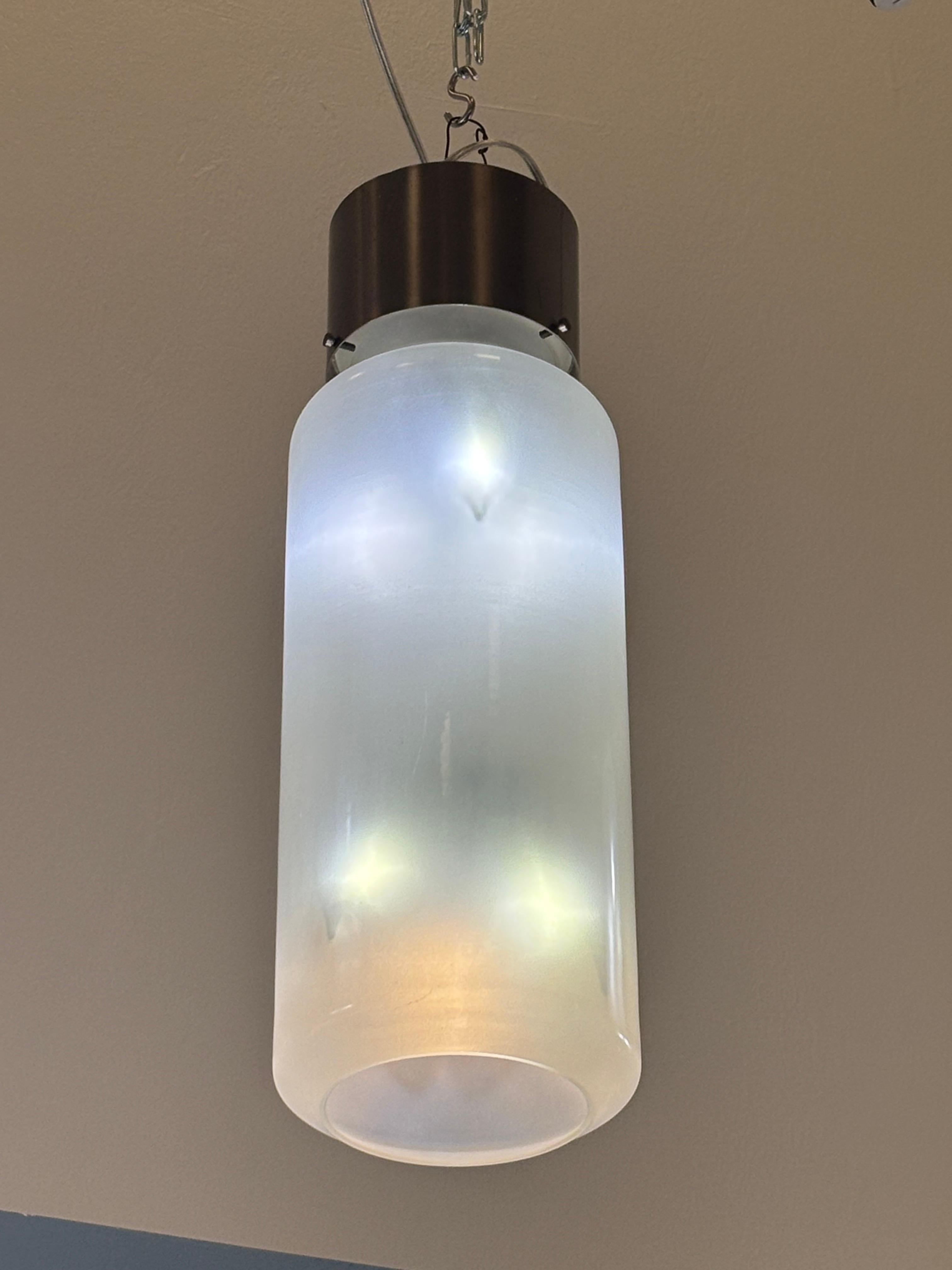 Set of five brushed nickel and glass pendant lights by Caccia Dominioni for Azucena. Pendants have been rewired for the United States. Dimensions are for the glass and metal portion only.