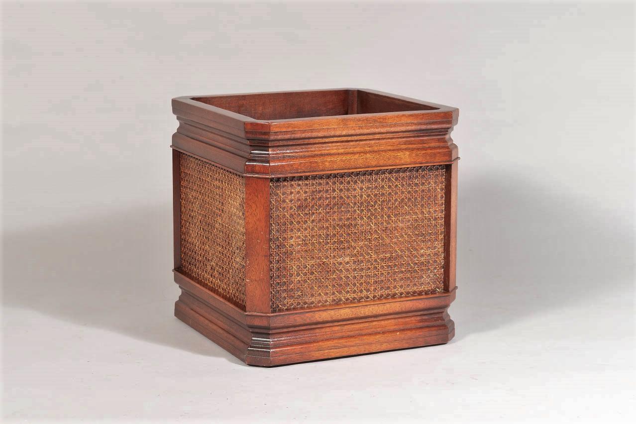 A Mahogany (Sapele) and Rattan, square shaped indoor planter jardinière stand.
A good quality, well made piece, moulded detailing to the top and base with rattan panels to the sided.  Finished in a lovely rich mahogany colour with contrasting