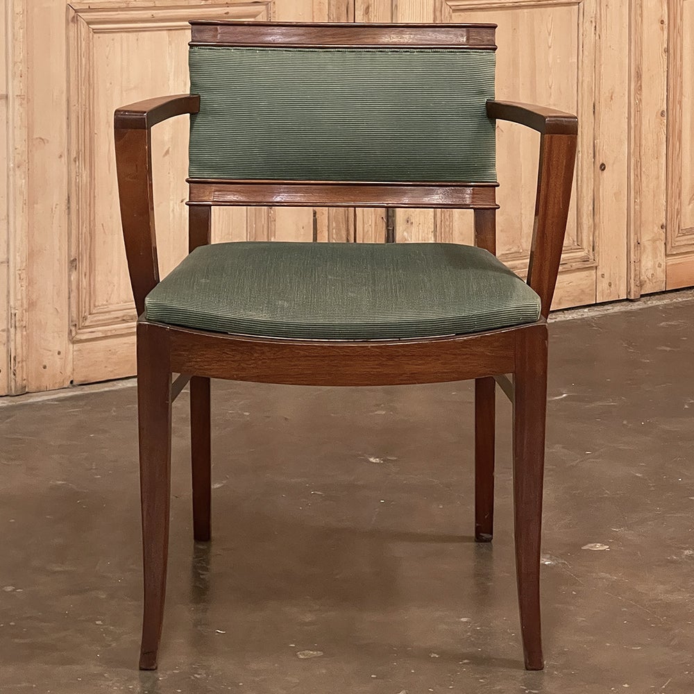 Mid-century mahogany armchair by De Coene is another example of the maker's highest-quality furnishings that made it so well known in European circles during the last half of the 20th century. Subtly curved, tailored lines abound in every framing