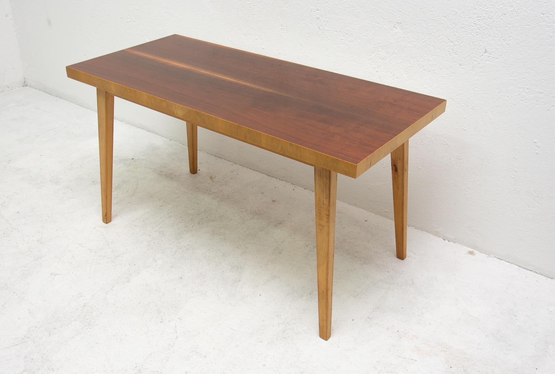Mid century coffee table, made in the former Czechoslovakia in the 1960´s.

It was produced by Stolak Tábor company. It´s made of elm wood and walnut with mahogany veneer. In very good Vintage condition.