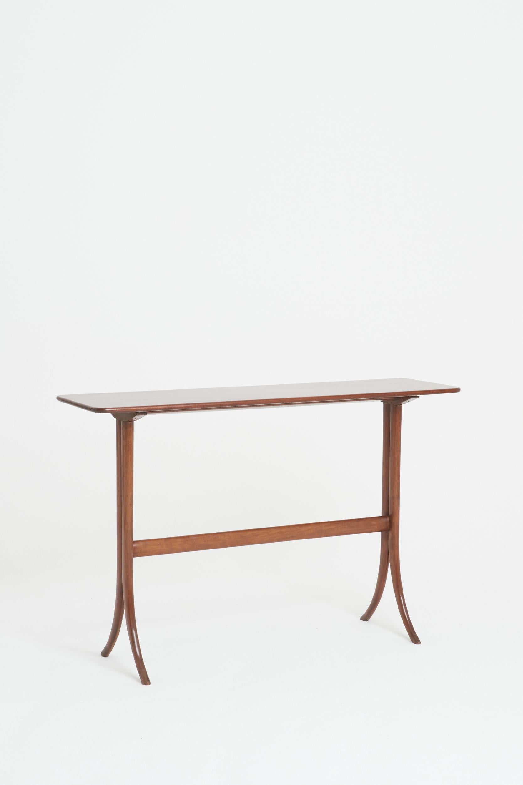 A mahogany console table
Italy, mid 20th Century