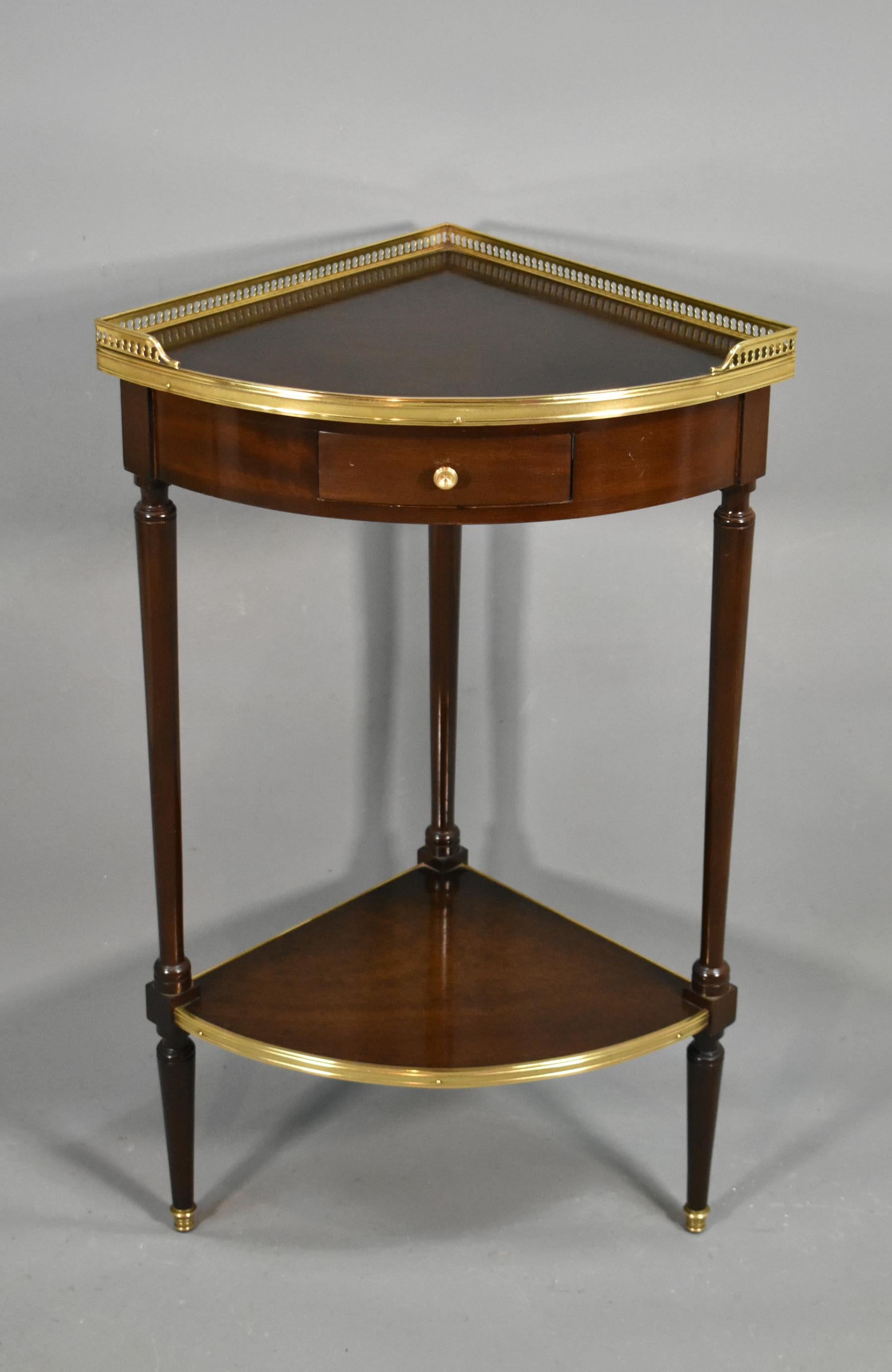 Mid-century French mahogany Corner table 

This beautifully made corner / side table features an unusual speckled mahogany root burr top and lower shelf. 

The top of this attractive corner table is surrounded by a pierced raised brass gallery.