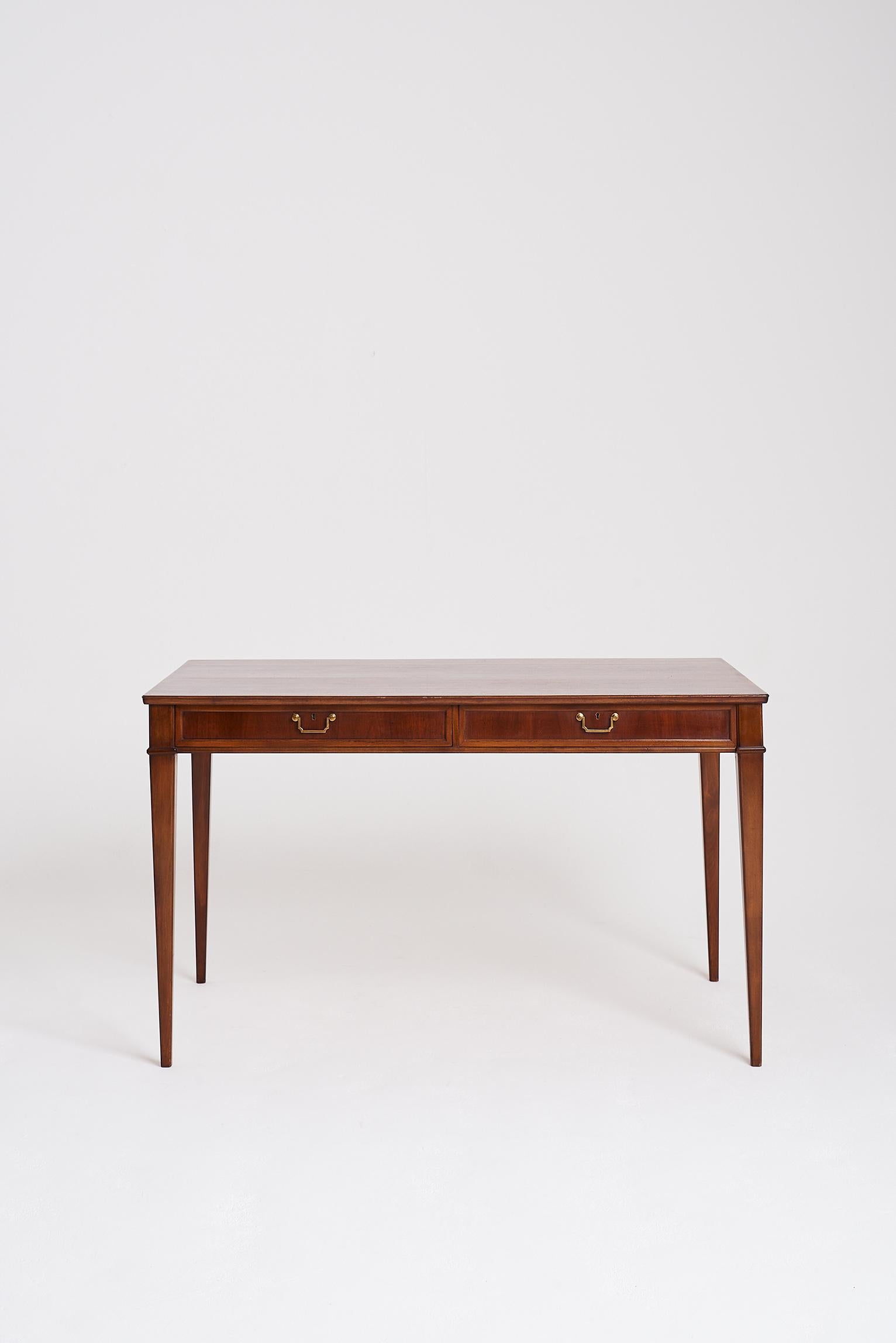 A midcentury mahogany and brass mounted bureau plat,
Sweden, circa 1950.