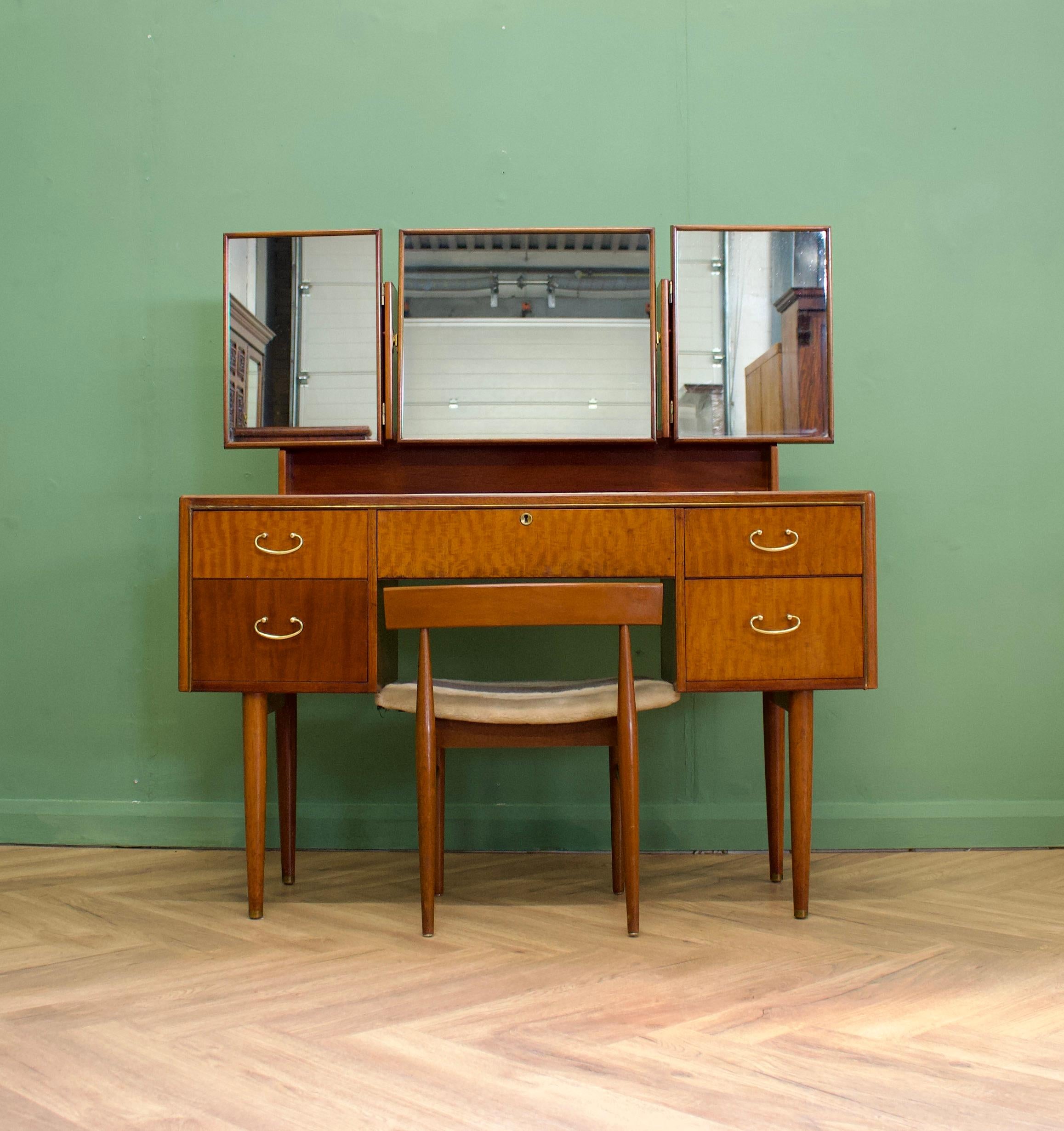 A mahogany dressing table and stool from Greaves and Thomas
Featuring five drawers - one is lockable but no key is present
The two side mirrors also feature hidden compartments behind them

Height to top of mirror 130cm.