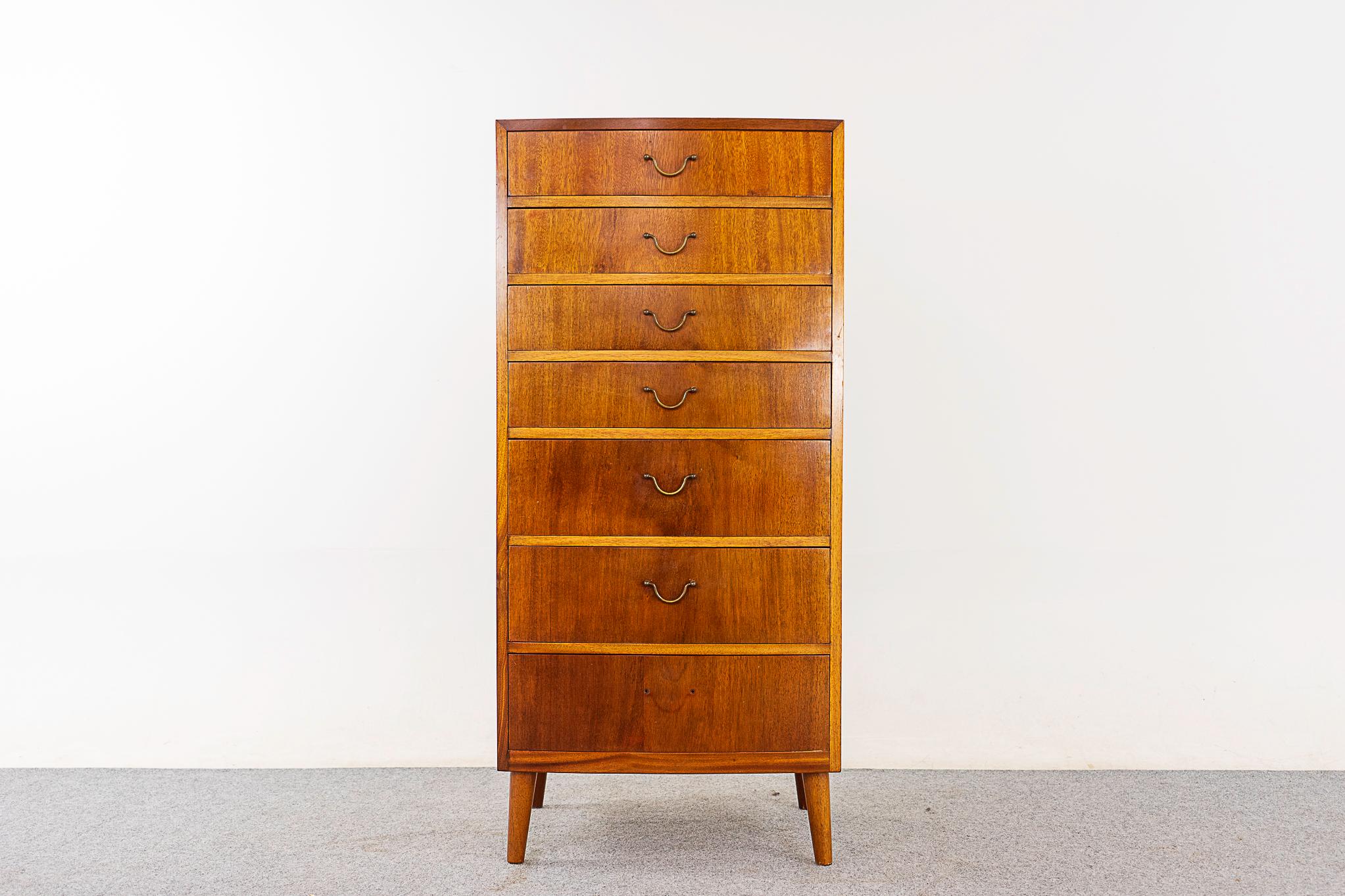 Mahogany Swedish dresser, circa 1950's. Slim proportions with solid wood edging and stunning book-matched veneer. Drawer faces have lovely grain patterns and dovetail construction. Darling metal finger pulls!

Unrestored item with option to purchase