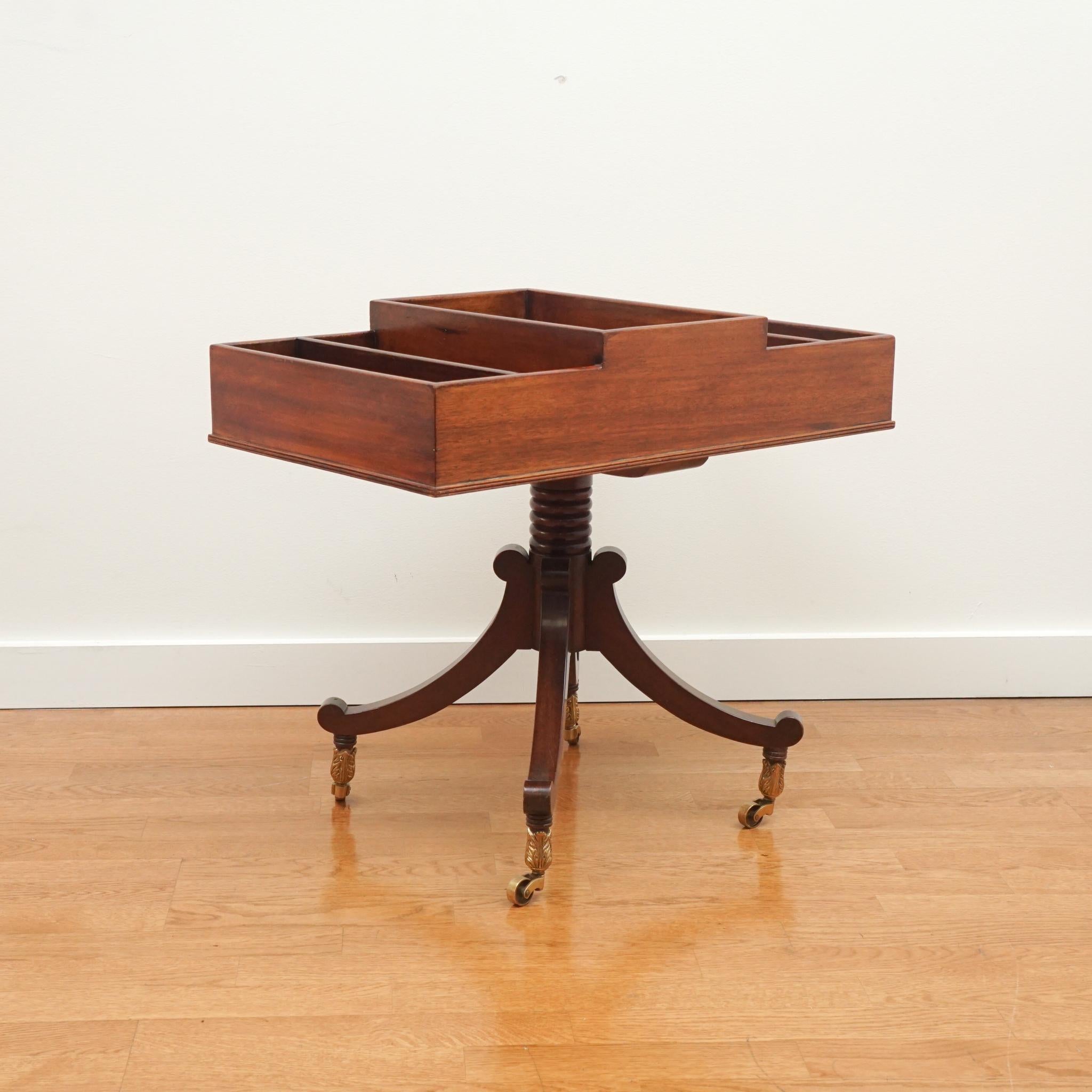 Circa 1960 by The Company Master Craftsman. Although designed for magazines, this exquisitely crafted mahogany table could serve a number functions from holding remotes, keys and collectibles to serving as a mini bar.  Its compact size makes it fit