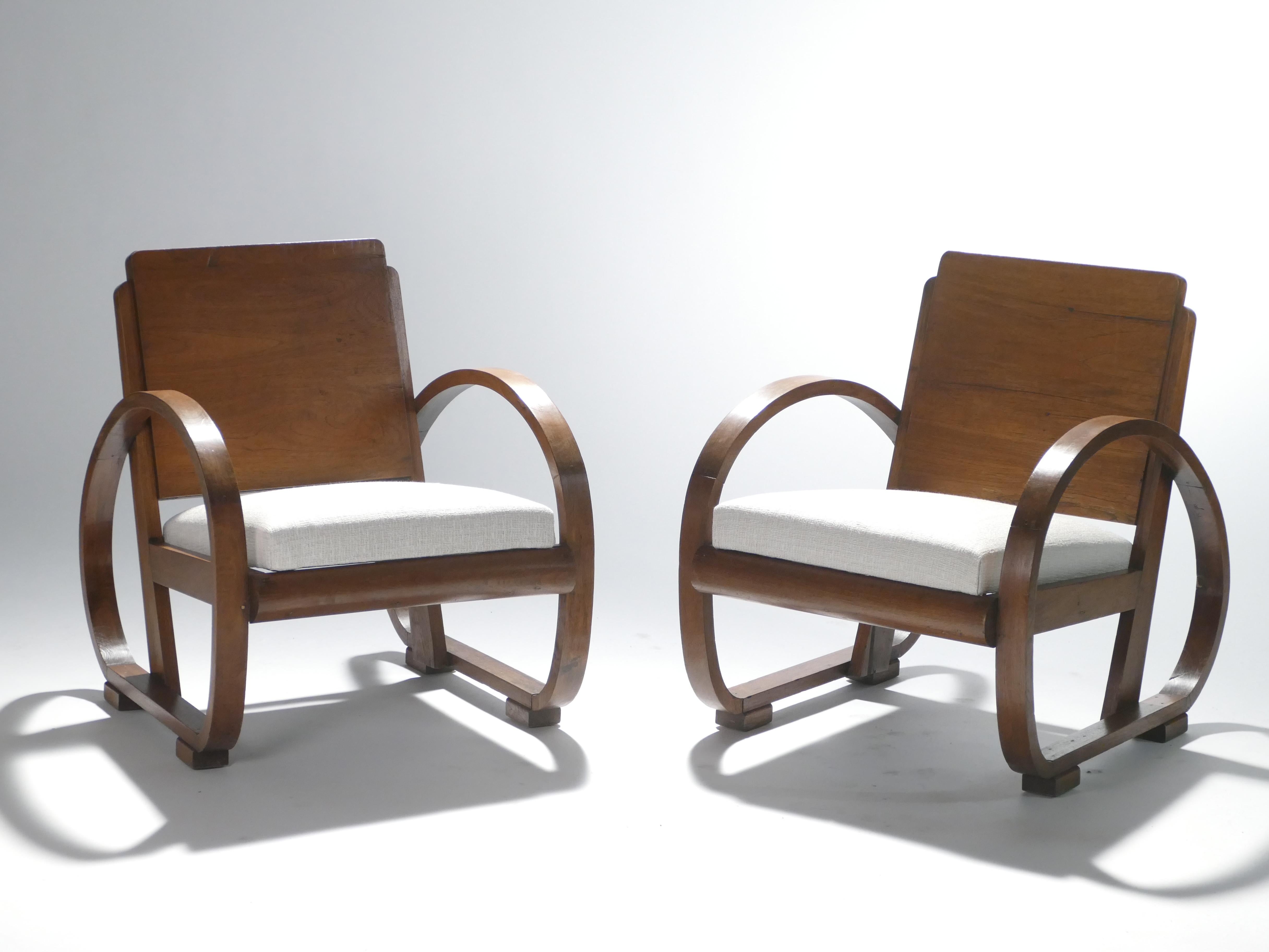 Lend your living room an unparalleled modern elegance with these 1940s armchairs. The arresting structure, rich creamy colors, and quality material make these pieces a stunning example of French art deco modernism. Lovely mahogany wood forms the