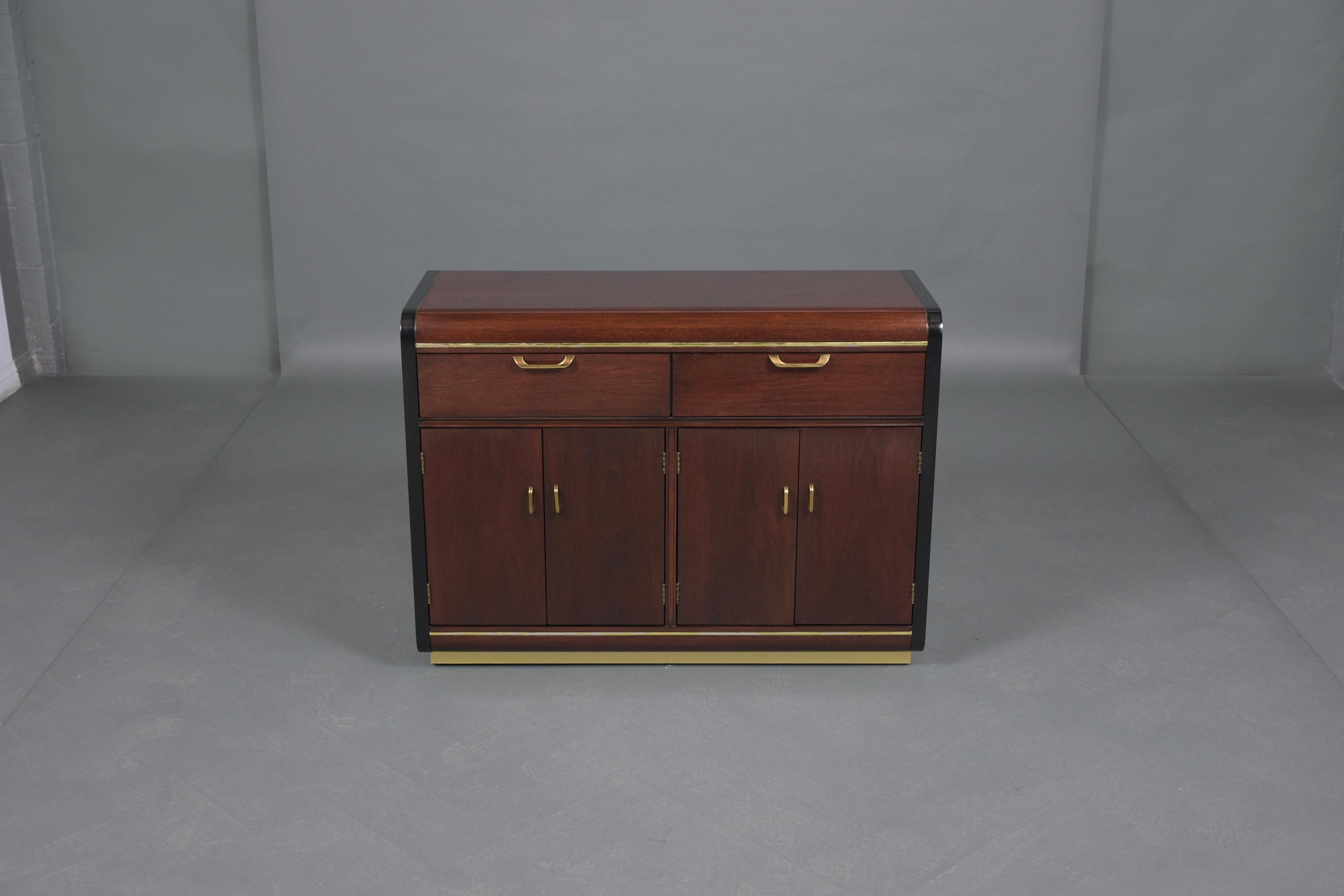 An extraordinary 1970s server crafted out of mahogany and professionally restored by our craftsman. This piece is eye-catching finished in beautiful mahogany and ebonized color combination with lacquer finish and come with two top drawers and four