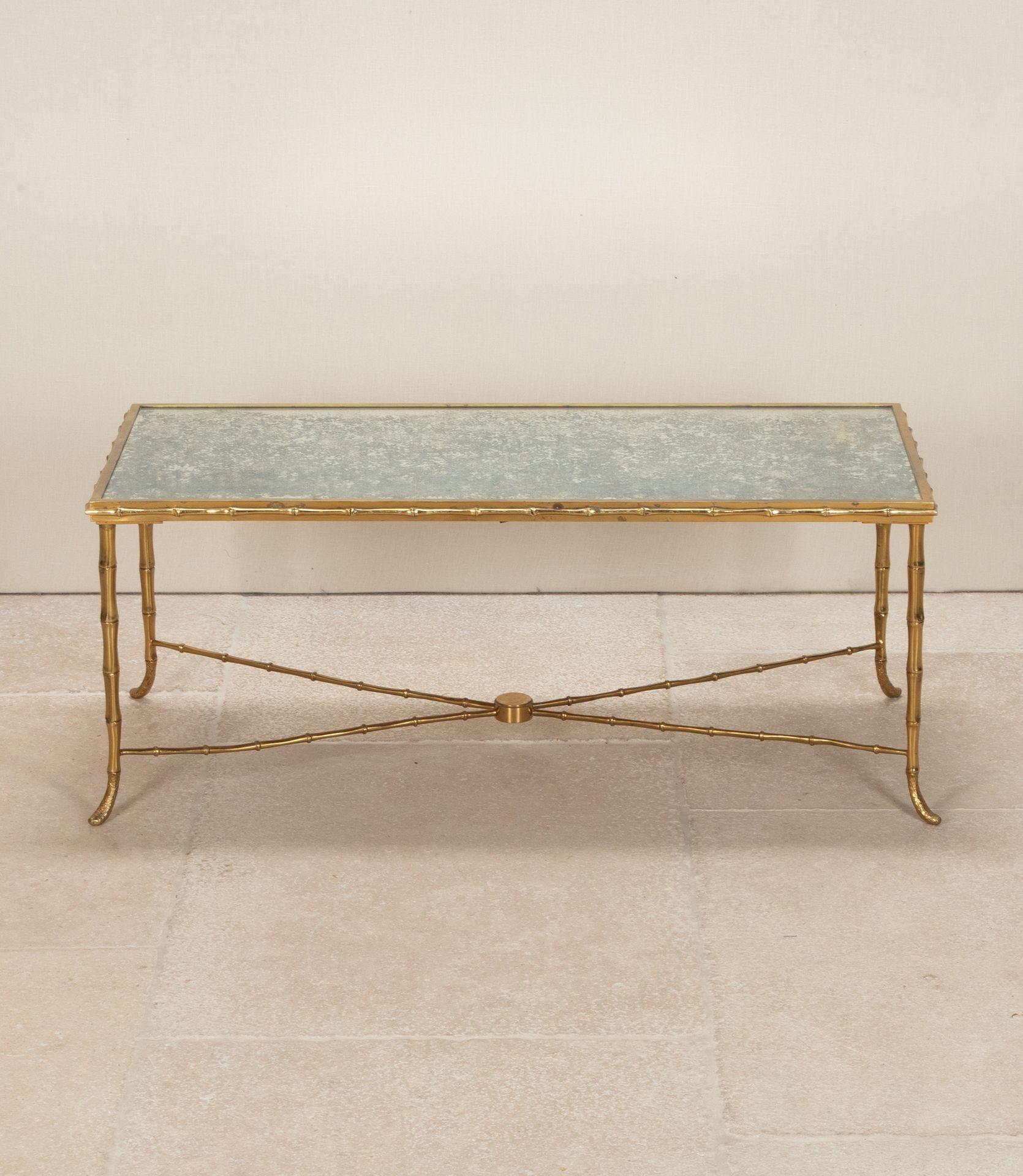 A very good quality mid-20th century Maison Bagues style faux bamboo gilt brass coffee table. With its original 'antiqued' mirrored top. Circa 1950.