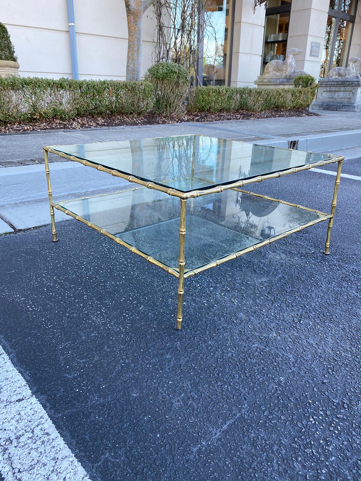 Mid-20th century circa 1960s/1960s Maison Baguès style bronze faux bamboo square two-tier coffee table with glass tops.