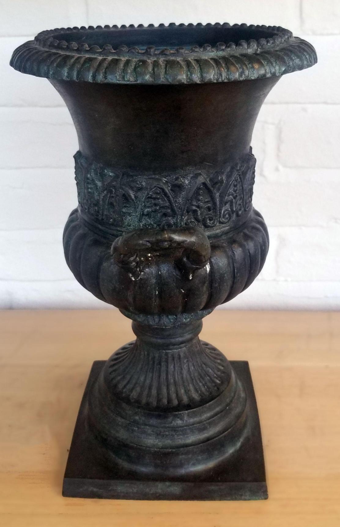Maitland Smith Dark Bronze pair of Urns

These urns are part of a two piece set of cast dark bronze metal, trophy urn with side handles, measuring 13